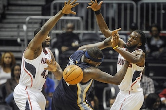 Carroll made a strong impression during 2011 summer pickup games against All-Stars like Elton Brand (left), who is now a close mentor to the Hawks' starting small forward.