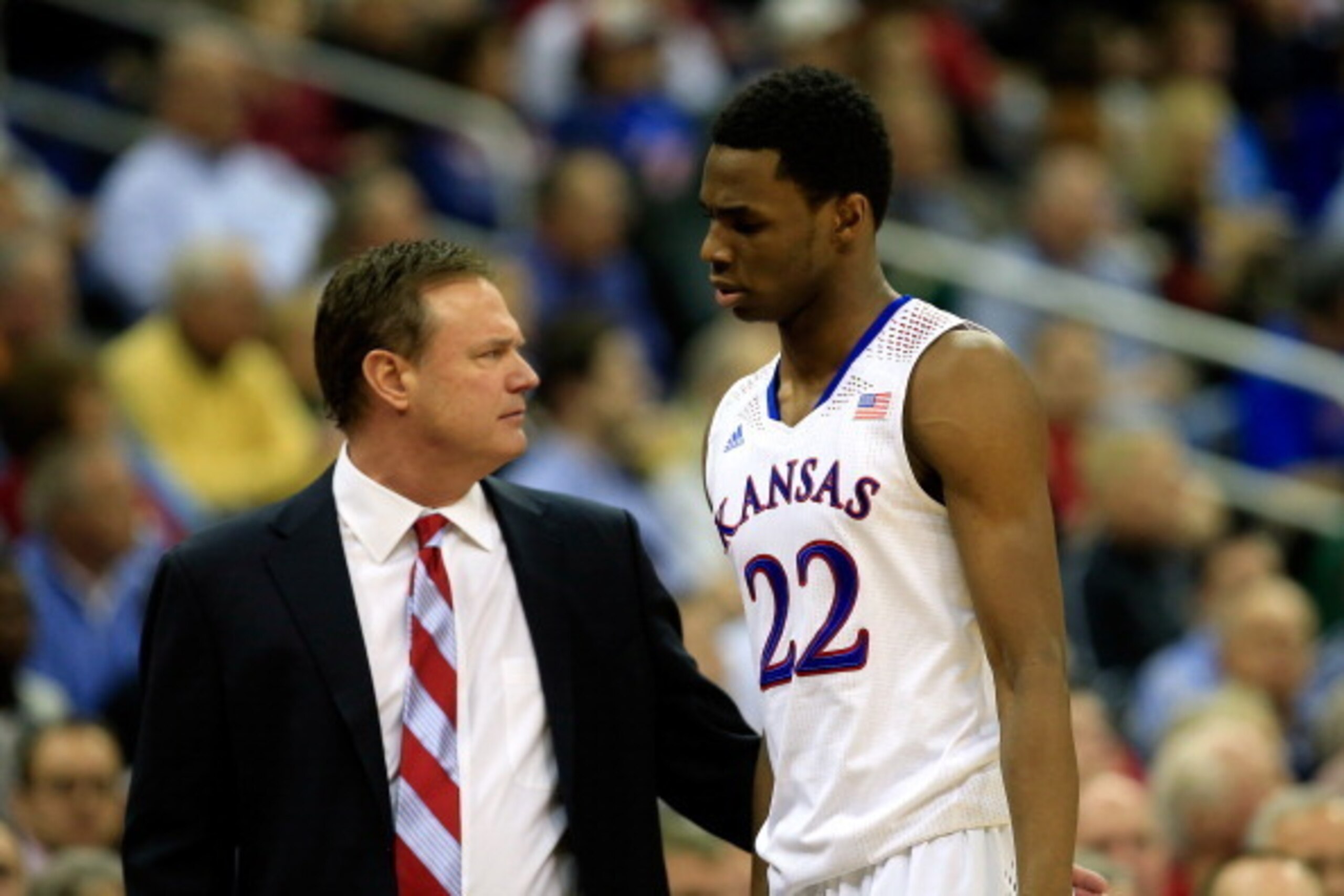 KANSAS CITY, MO - MARCH 14:  Andrew Wiggins #22 of the Kansas Jayhawks walks off the court past head coach Bill Self during the Big 12 Basketball Tournament semifinal game against the Iowa State Cyclones at Sprint Center on March 14, 2014 in Kansas City, 