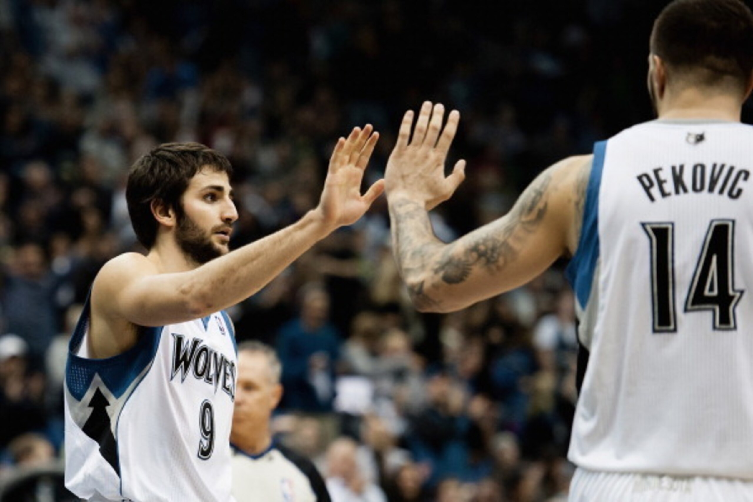 MINNEAPOLIS, MN - OCTOBER 30: Ricky Rubio #9 and Nikola Pekovic #14 of the Minnesota Timberwolves celebrate a play during the game against the Orlando Magic on October 30, 2013 at Target Center in Minneapolis, Minnesota. NOTE TO USER: User expressly ackno