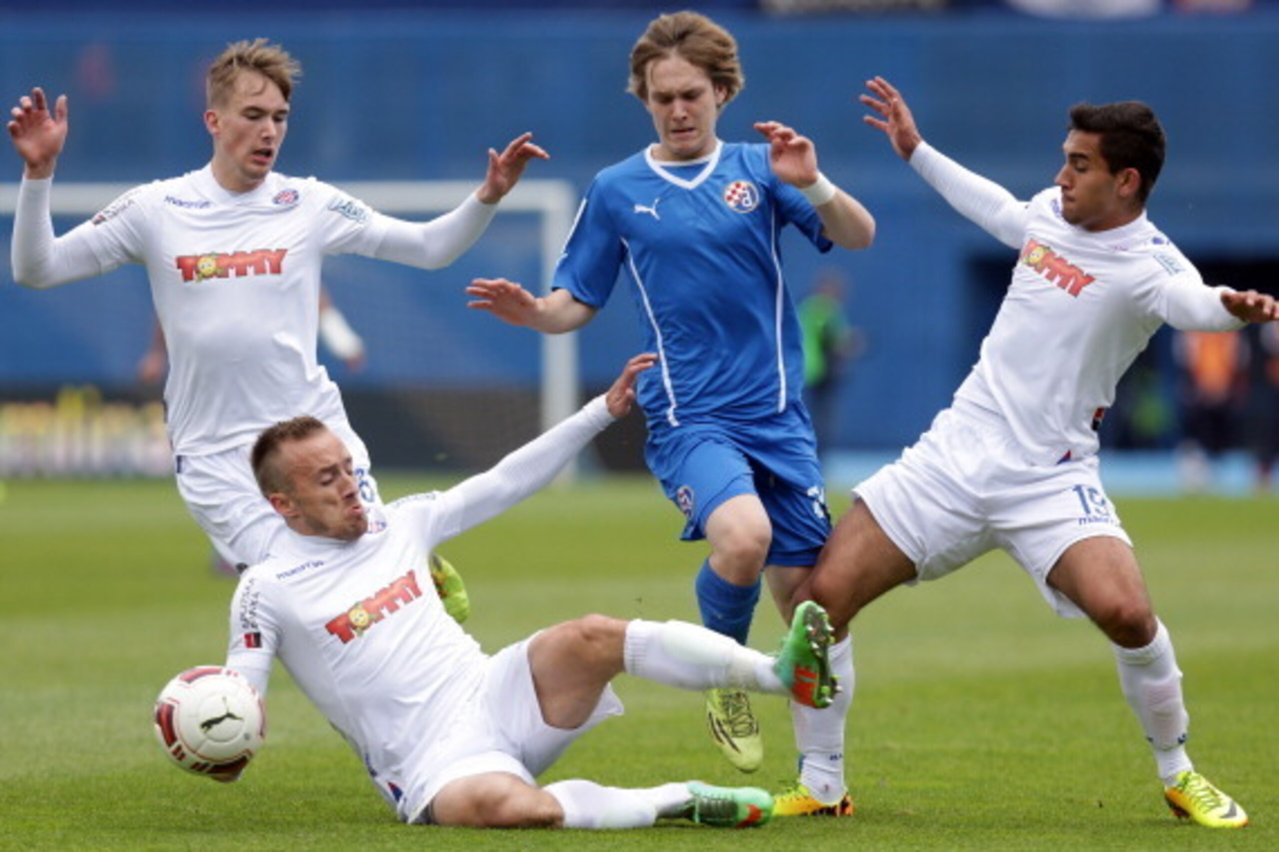ZAGREB,CROATIA - MAY 17:  Alen Halilovic (C) of FC Dinamo Zagreb is challenged by Filip Bradaric (L), Avdija Vrsajevic (down) and Elivir Maloku (R) of FC Hajduk Split during the Croatian Prva HNL Liga match between FC Dinamo Zagreb and FC Hajduk Split at 