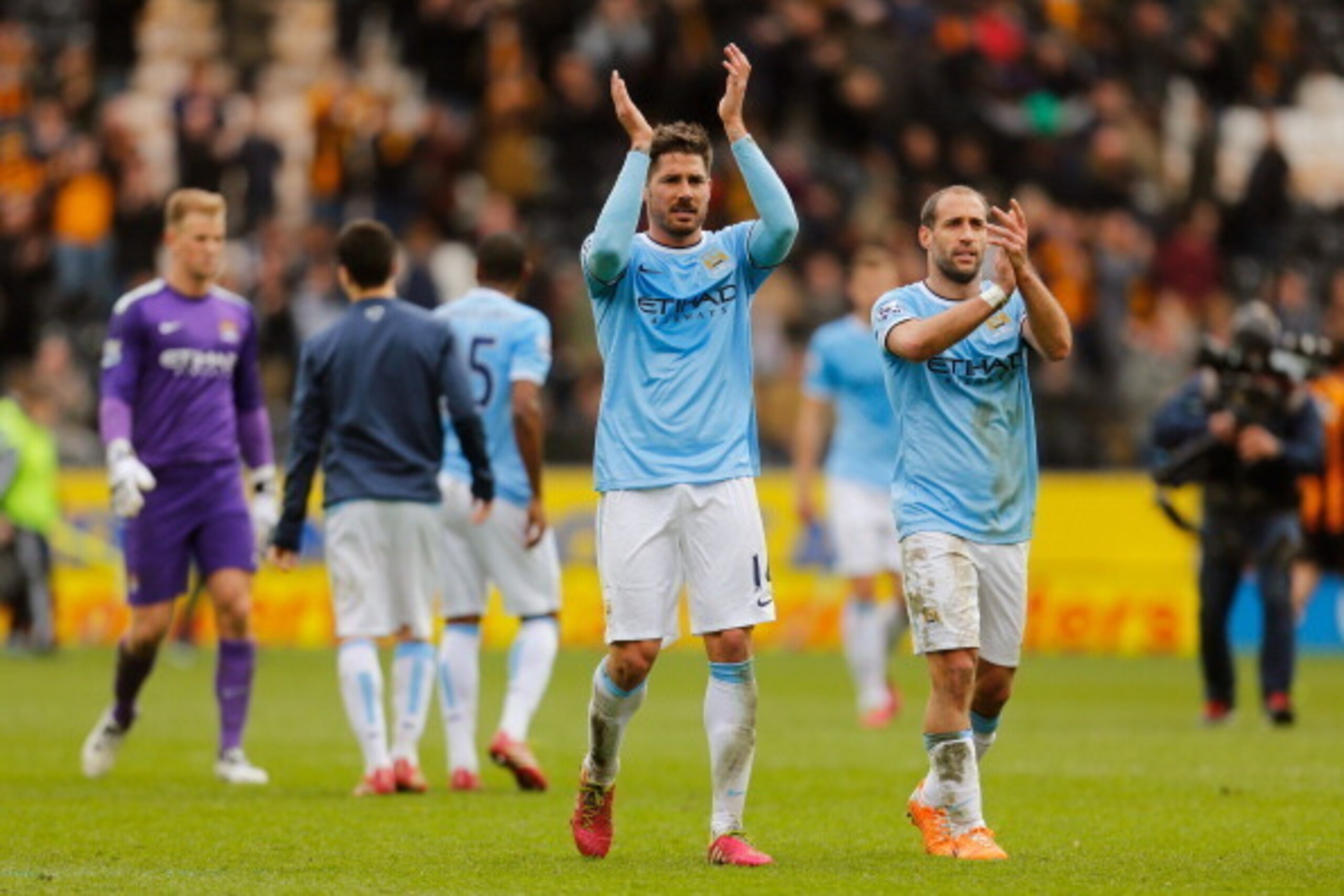 HULL, ENGLAND - MARCH 15:  Javi Garcia and Pablo Zabaleta of Manchester City applaud the travelling fans following their team's 2-0 victory during the Barclays Premier league match between Hull City and Manchester City at KC Stadium on March 15, 2014 in H