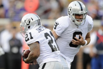 MINNEAPOLIS, MN - AUGUST 8: Matt Schaub #8 of the Oakland Raiders hands the ball to teammate Maurice Jones-Drew #21 during the first quarter of the game against the Minnesota Vikings on August 8, 2014 at TCF Bank Stadium in Minneapolis, Minnesota. (Photo 