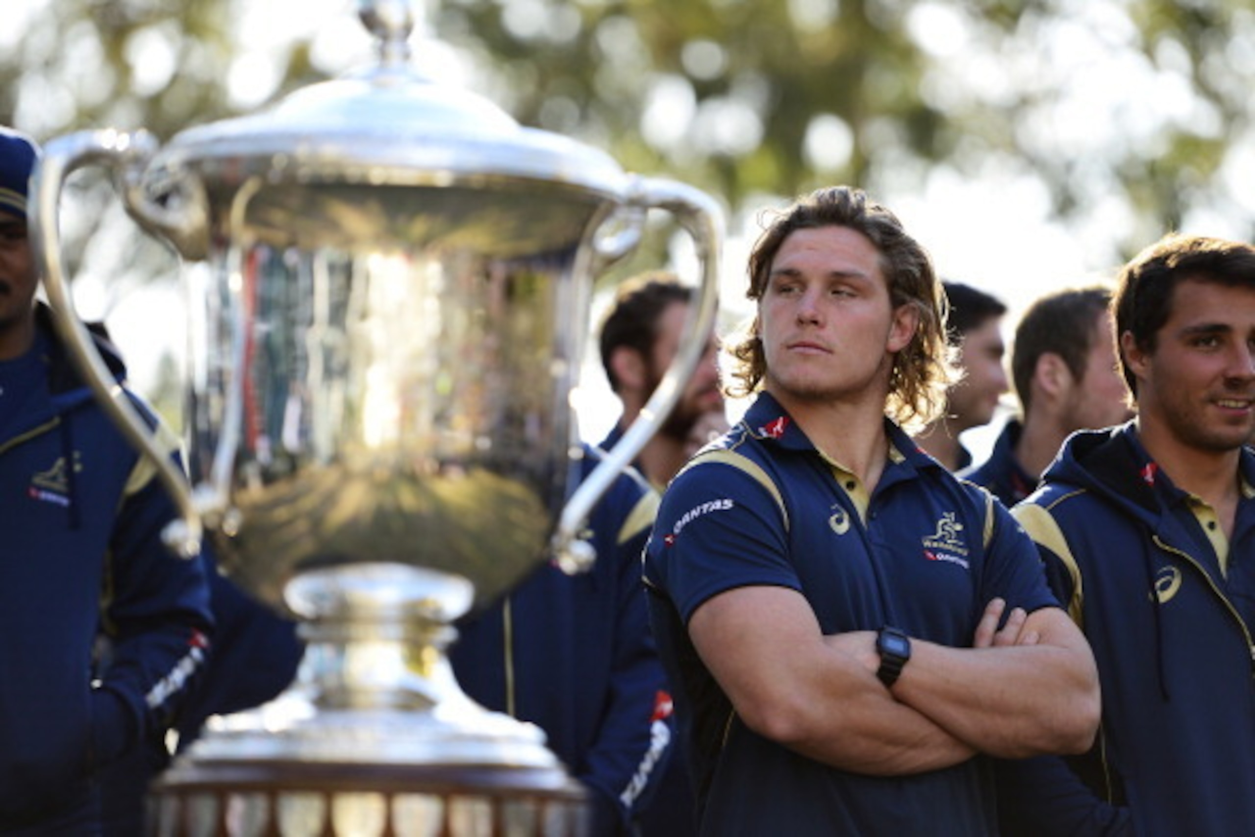 PENRITH, AUSTRALIA - AUGUST 08:  Michael Hooper of the Wallabies stands infront of the Bledisloe Cup during an Australian Wallabies fan day event at The Mondo on August 8, 2014 in Penrith, Australia.  (Photo by Brett Hemmings/Getty Images)