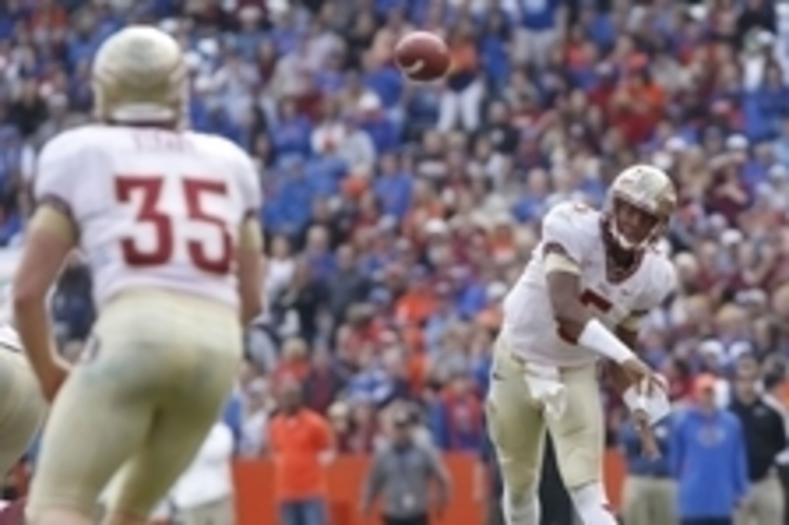 Nov 30, 2013; Gainesville, FL, USA; Florida State Seminoles quarterback Jameis Winston (5) throws the ball to tight end Nick O'Leary (35) during the second half at Ben Hill Griffin Stadium. Florida State Seminoles defeated the Florida Gators 37-7. Mandato