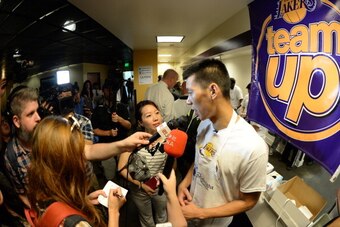 LOS ANGELES, CA - JULY 24: Jeremy Lin #17 of the Los Angeles Lakers speaks to the media during a Team Up Event at the Midnight Mission on July 24, 2014 in Los Angeles, California. NOTE TO USER: User expressly acknowledges and agrees that, by downloading a