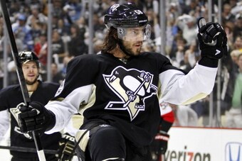 PITTSBURGH, PA - MAY 24:  Kris Letang #58 of the Pittsburgh Penguins celebrates his second-period goal against the Ottawa Senators in Game Five of the Eastern Conference Semifinals during the 2013 NHL Stanley Cup Playoffs at Consol Energy Center on May 24