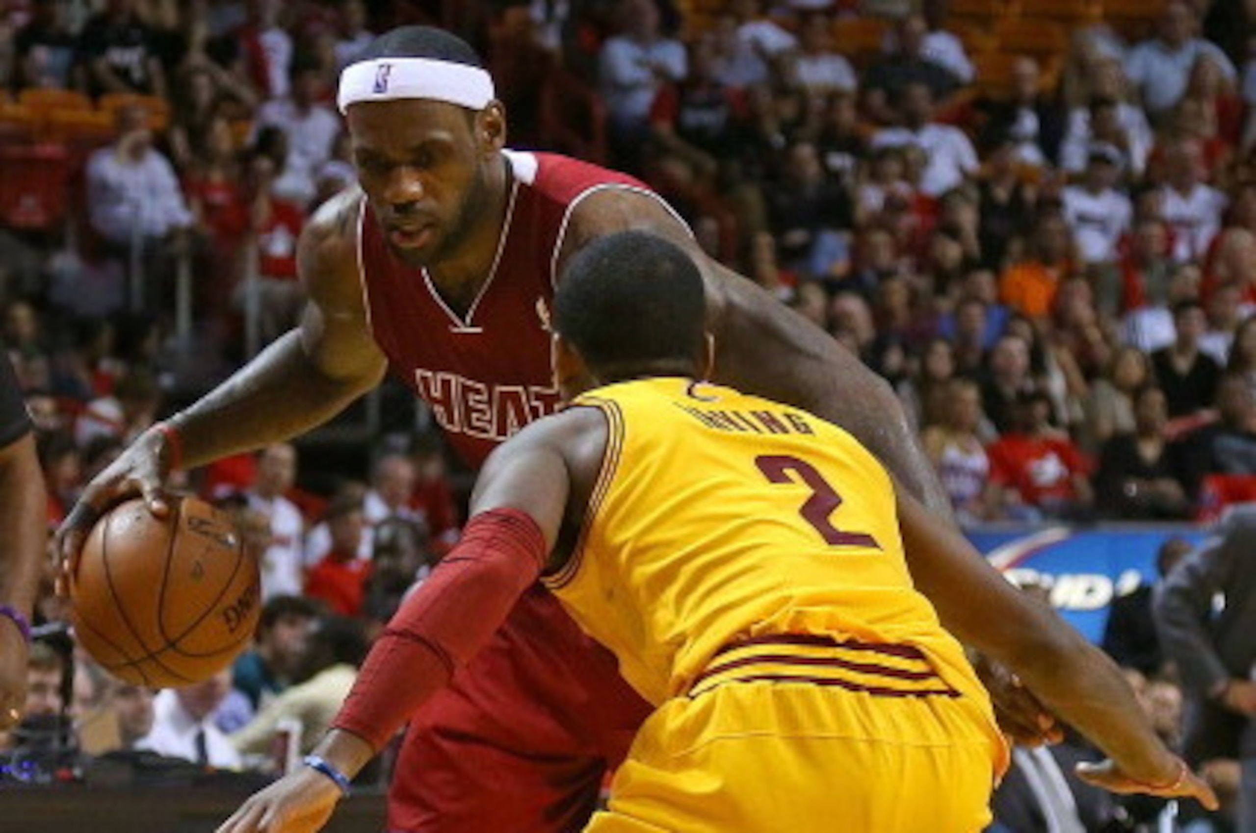 MIAMI, FL - DECEMBER 14: LeBron James #6 of the Miami Heat drives on Kyrie Irving #2 of the Cleveland Cavaliers during a game at American Airlines Arena on December 14, 2013 in Miami, Florida. NOTE TO USER: User expressly acknowledges and agrees that, b MIAMI, FL - DECEMBER 14: LeBron James #6 of the Miami Heat drives on Kyrie Irving #2 of the Cleveland Cavaliers during a game at American Airlines Arena on December 14, 2013 in Miami, Florida. NOTE TO USER: User expressly acknowledges and agrees that, b