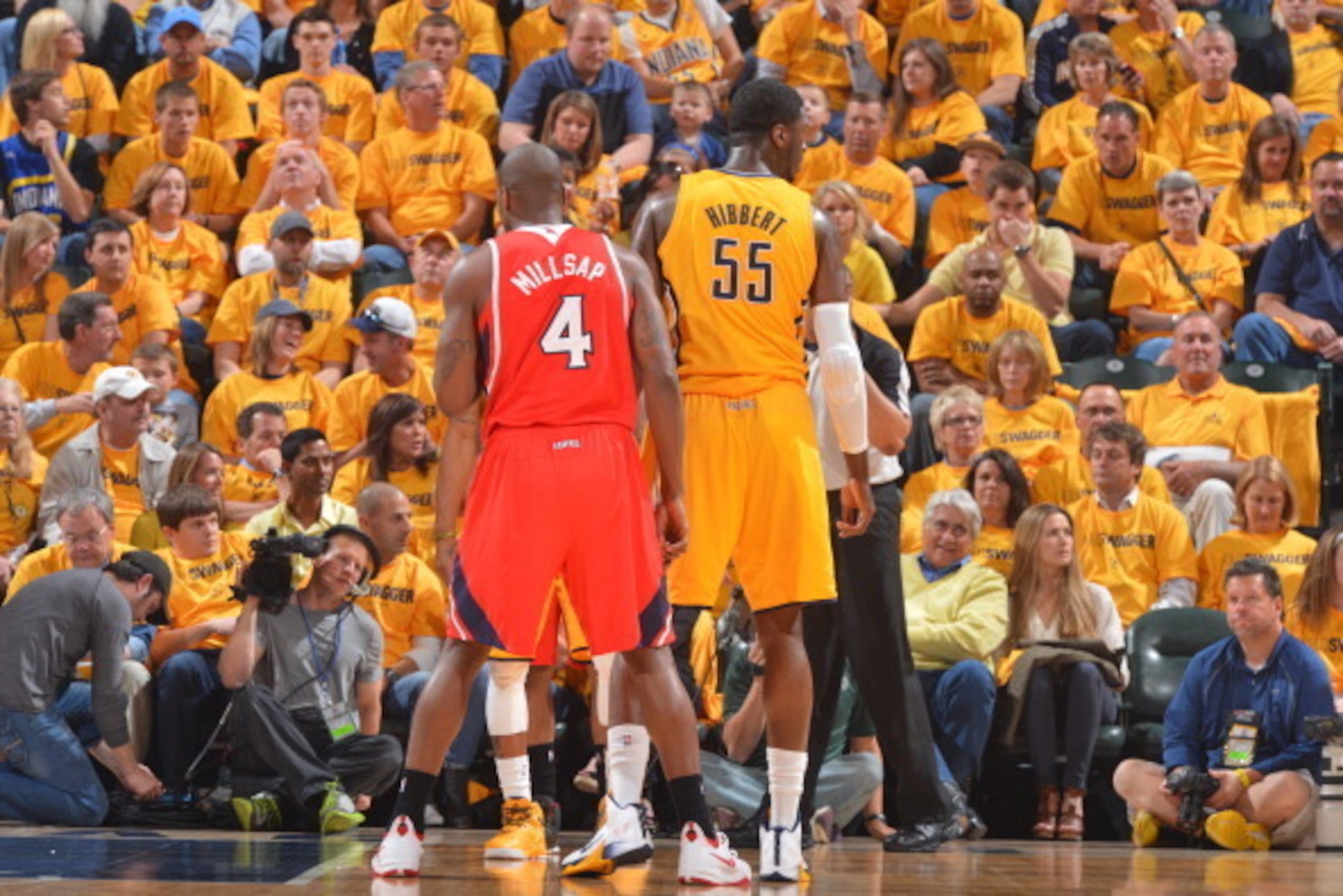 INDIANAPOLIS, IN - MAY 03: Paul Millsap #4 of the Atlanta Hawks and Roy Hibbert #55 of the Indiana Pacers on the court during game Seven of the Eastern Conference Playoffs at the Bankers Life Fieldhouse on May 3, 2014 in Indianapolis, Indiana. NOTE TO USE