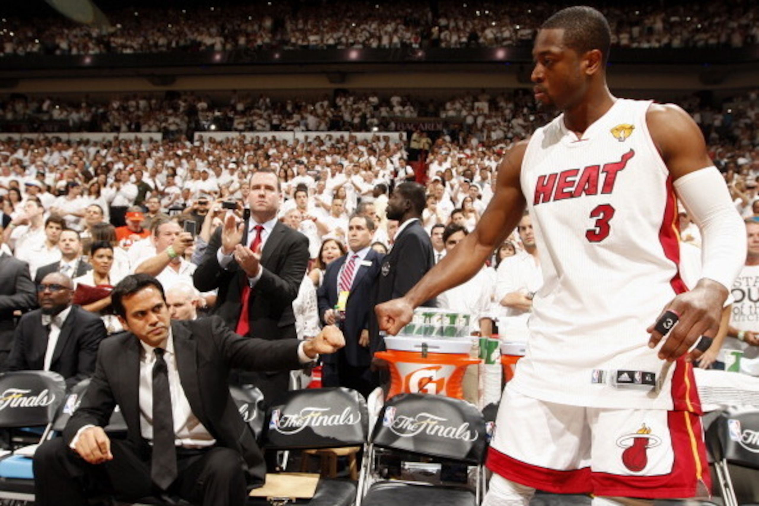 MIAMI, FL - JUNE 21:  Head Coach Erik Spoelstra of the Miami Heat fist pumps Dwyane Wade #3 prior to Game Five of the 2012 NBA Finals against the Oklahoma City Thunder at American Airlines Arena on June 21, 2012 in Miami, Florida. NOTE TO USER: User expre