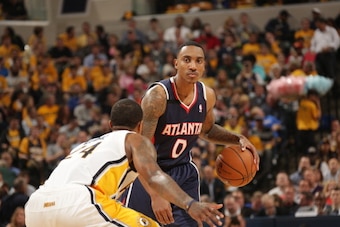 INDIANAPOLIS - APRIL 22 Jeff Teague #0 of the Atlanta Hawks looks to pass the ball against the Indiana Pacers in the East Conference Quarter Finals Game Two at Bankers Life Fieldhouse on April 22 2014 in Indianapolis, Indiana.  NOTE TO USER: User expressl