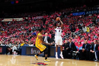 ATLANTA, GA - MAY 1: Paul Millsap #4 of the Atlanta Hawks shoots the ball during Game Six of the Eastern Conference Quarterfinals against the Indiana Pacers on May 1, 2014 at Philips Arena in Atlanta, Georgia.  NOTE TO USER: User expressly acknowledges an