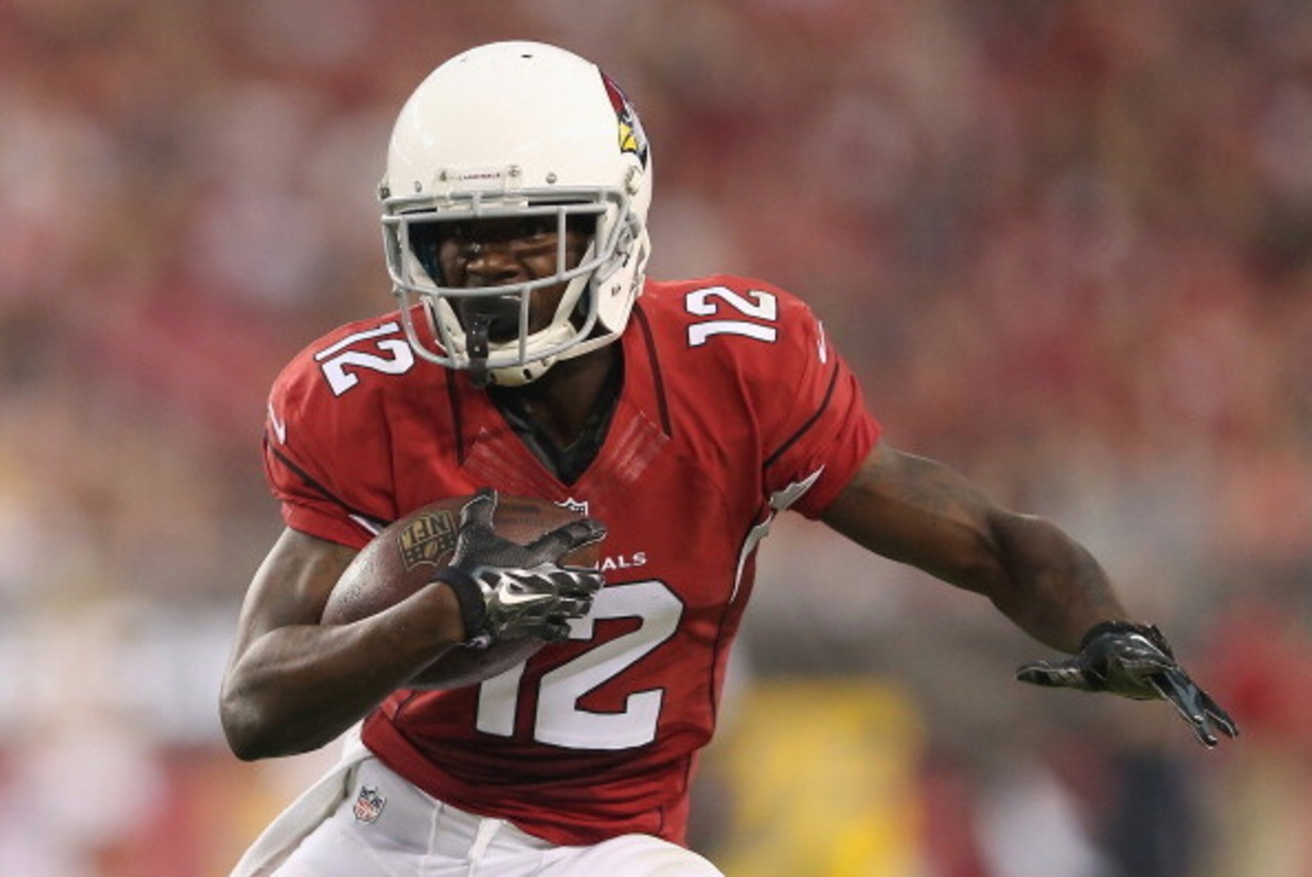 GLENDALE, AZ - AUGUST 09:  Wide receiver John Brown #12 of the Arizona Cardinals runs with the football after a reception against the Houston Texans during the preseason NFL game at the University of Phoenix Stadium on August 9, 2014 in Glendale, Arizona.
