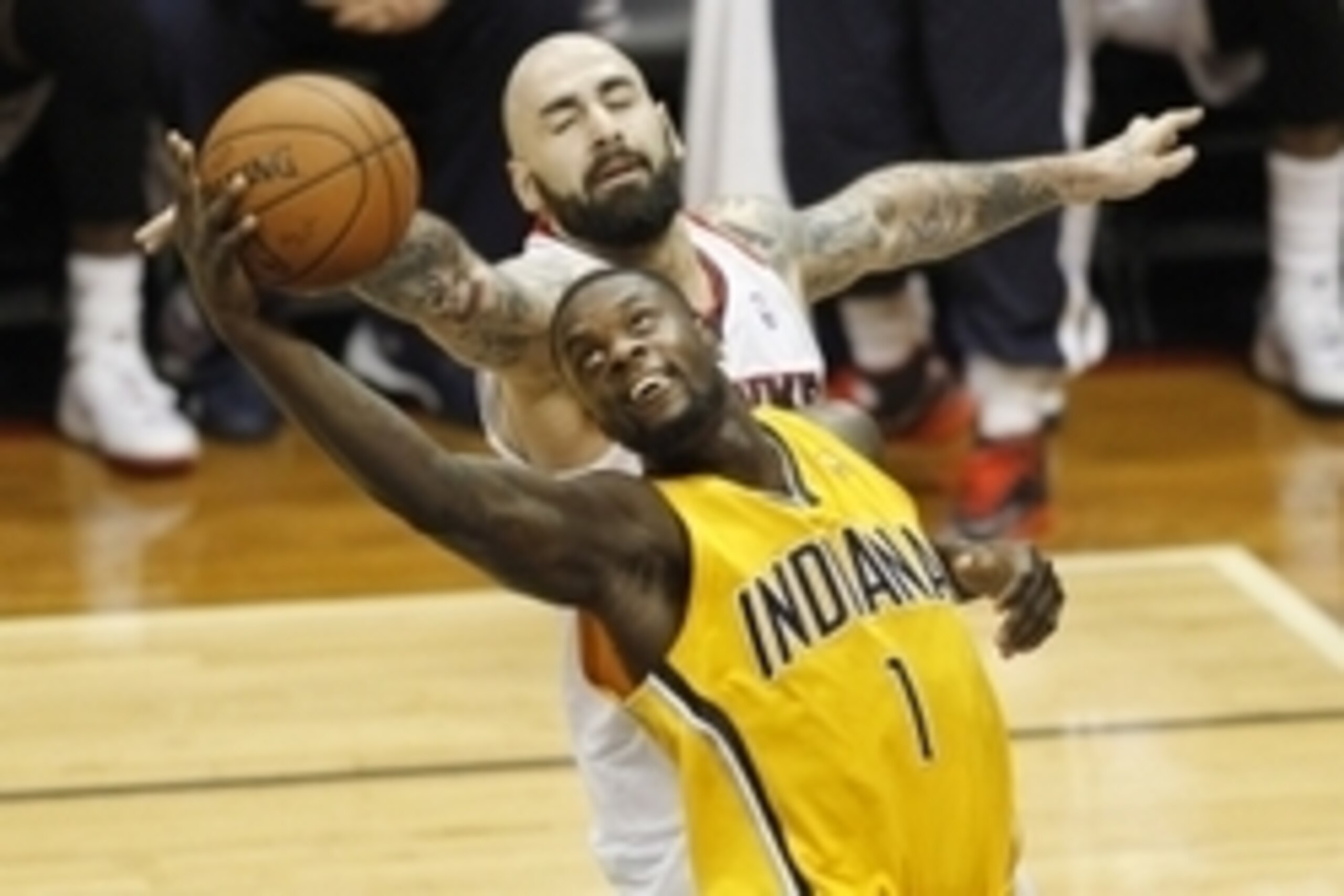 Apr 26, 2014; Atlanta, GA, USA; Indiana Pacers guard Lance Stephenson (1) grabs a rebound past Atlanta Hawks center Pero Antic (6) in the third quarter in game four of the first round of the 2014 NBA Playoffs at Philips Arena. Mandatory Credit: Brett Davi