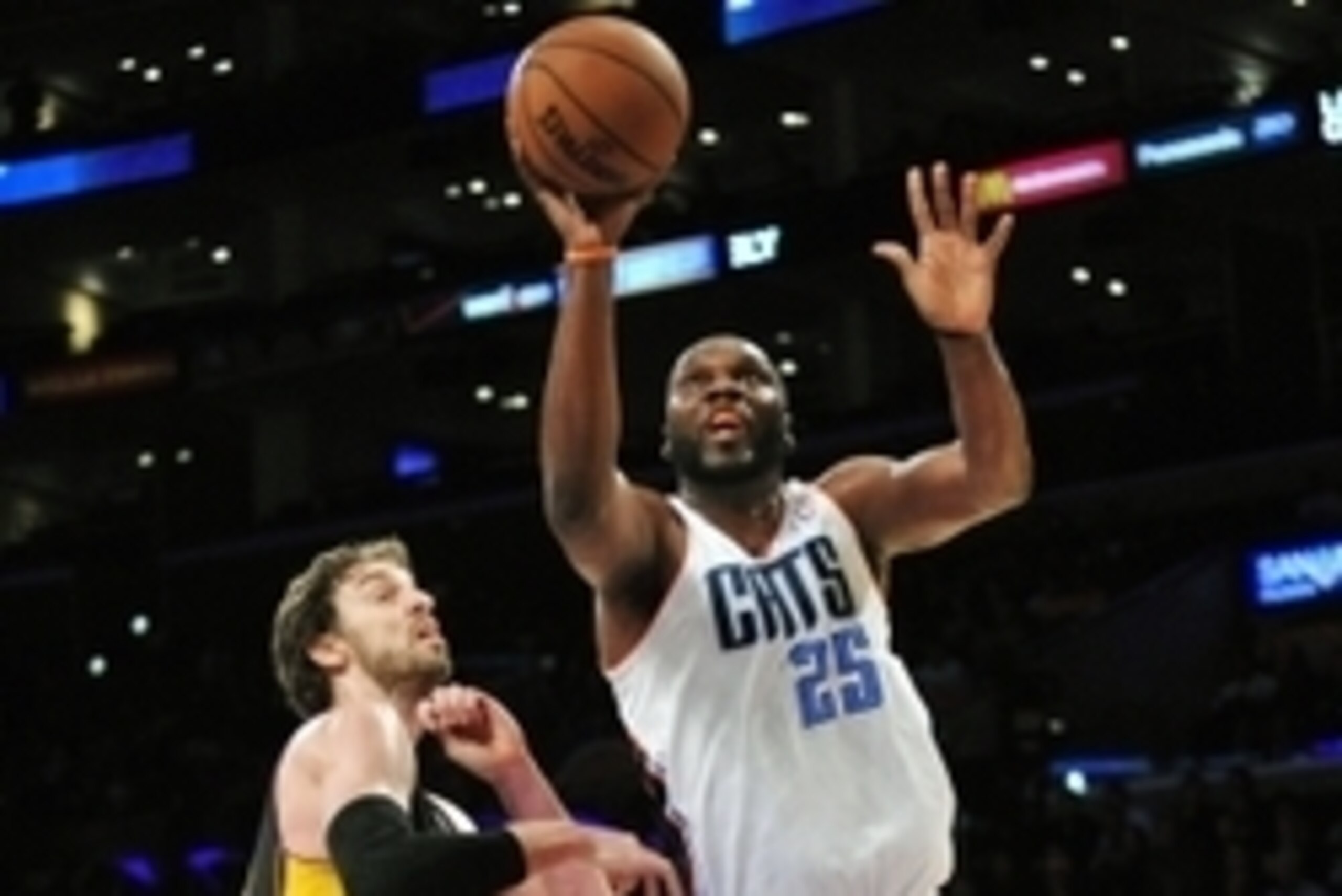 January 31, 2014; Los Angeles, CA, USA; Charlotte Bobcats center Al Jefferson (25) moves to the basket against the defense of Los Angeles Lakers center Pau Gasol (16) during the first half at Staples Center. Mandatory Credit: Gary A. Vasquez-USA TODAY Spo