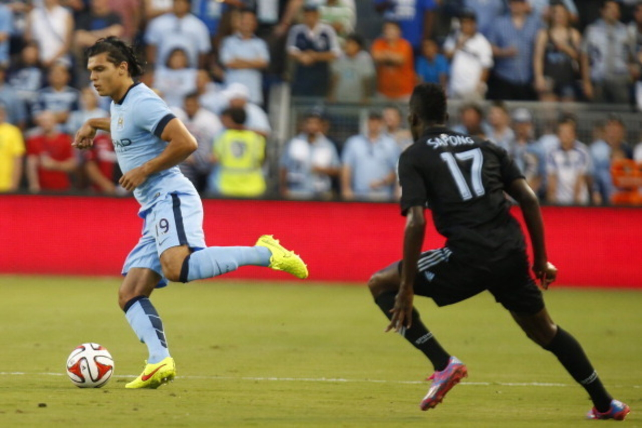 KANSAS CITY, KS - JULY 23: Karim Rekik #19 of Manchester City drives around the Sporting KC defense midway in the first half on July 23rd at Sporting Park in Kansas City, Kansas. (Photo by Kyle Rivas/Getty Images)