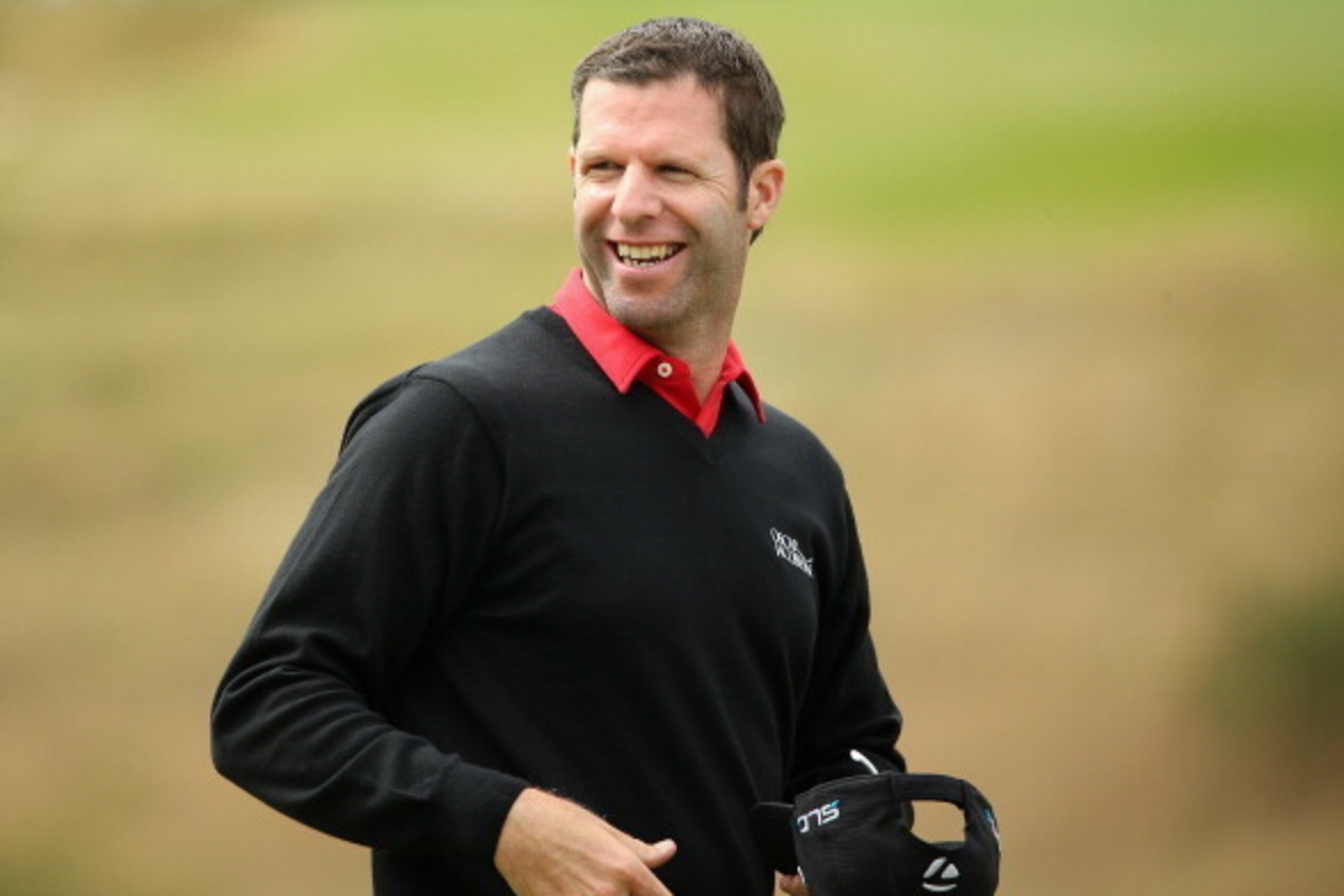 AALBORG, DENMARK - AUGUST 14:  Bradley Dredge of Wales smiles after his birdie on the ninth hole during the first round of the Made In Denmark at Himmerland Golf & Spa Resort on August 14, 2014 in Aalborg, Denmark.  (Photo by Andrew Redington/Getty Images