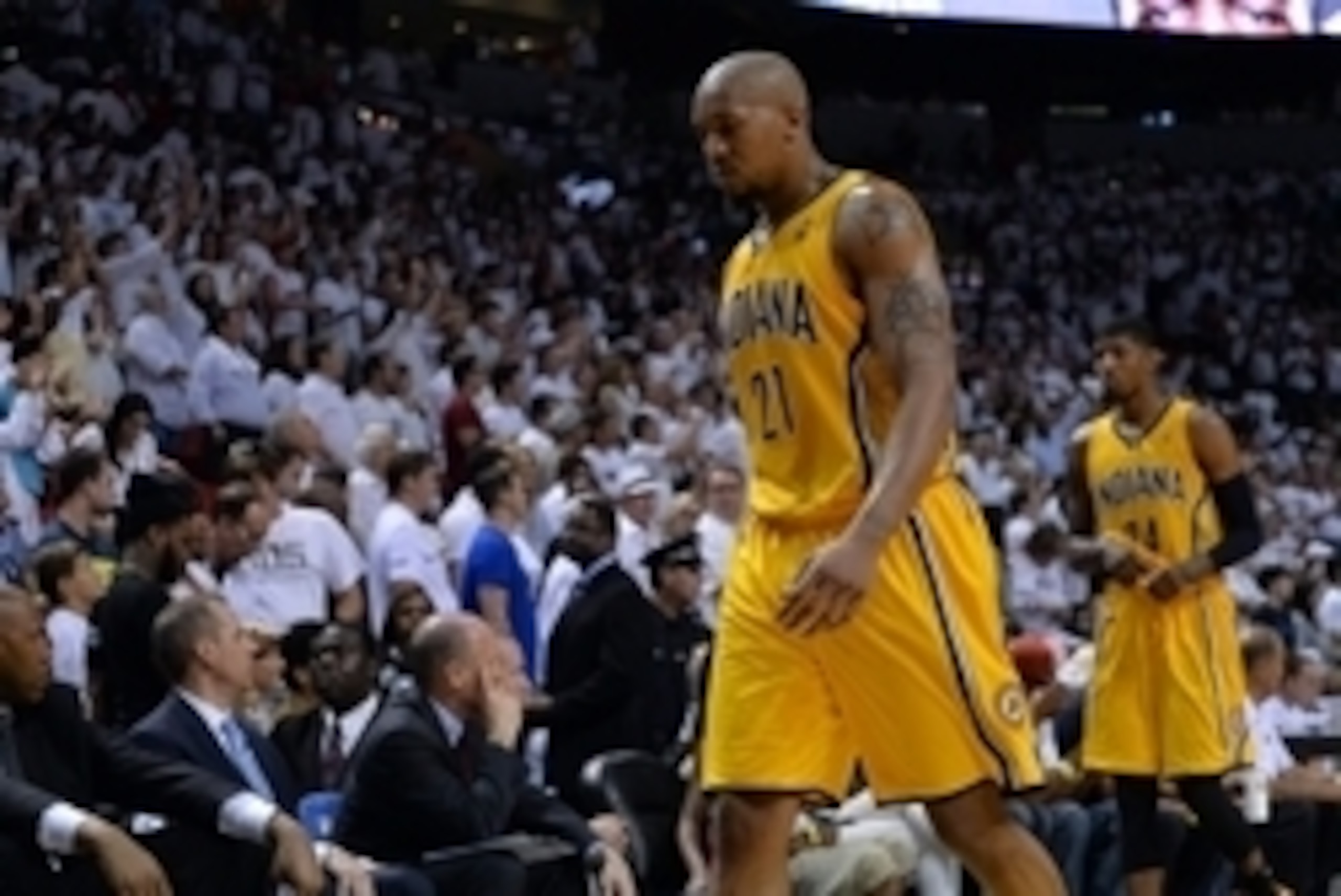 May 24, 2014; Miami, FL, USA; Indiana Pacers forward David West (21) and forward Paul George (24) walk off the court following game three of the Eastern Conference Finals of the 2014 NBA Playoffs at American Airlines Arena. Miami Heat defeated the Indiana