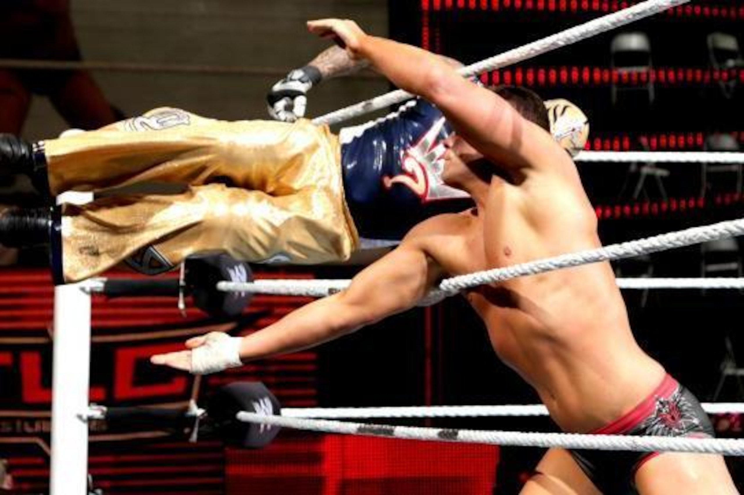 Rey Mysterio flies at Cody Rhodes at TLC 2013. Rey Mysterio flies at Cody Rhodes at TLC 2013.