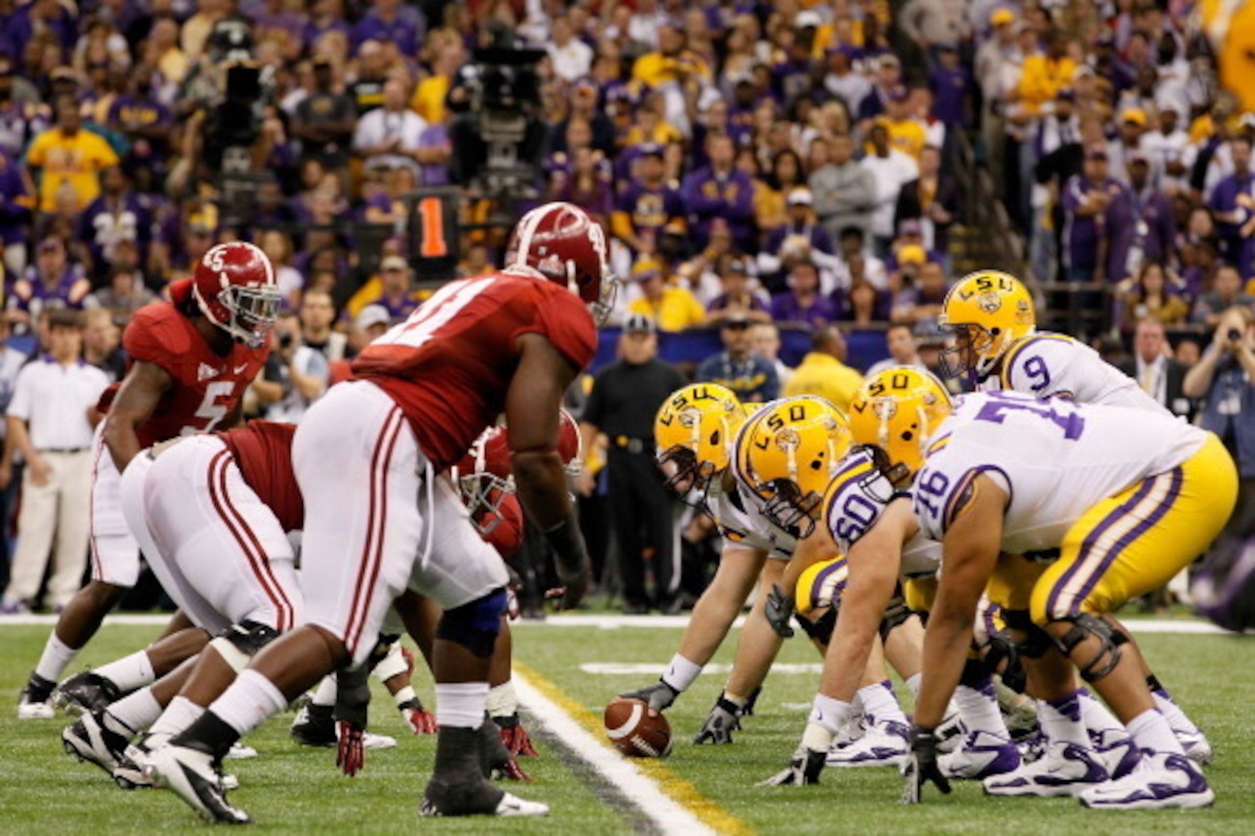 NEW ORLEANS, LA - JANUARY 09:  Jordan Jefferson #9 and the Louisiana State University Tigers line up against the Alabama Crimson Tide during the 2012 Allstate BCS National Championship Game at Mercedes-Benz Superdome on January 9, 2012 in New Orleans, Lou