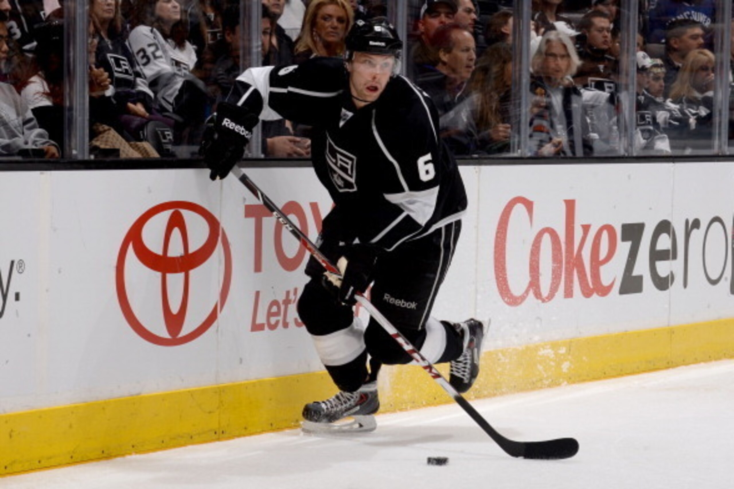 LOS ANGELES, CA - NOVEMBER 9:  Jake Muzzin #6 of the Los Angeles Kings skates with the puck against the Vancouver Canucks at Staples Center on November 9, 2013 in Los Angeles, California. (Photo by Noah Graham/NHLI via Getty Images)