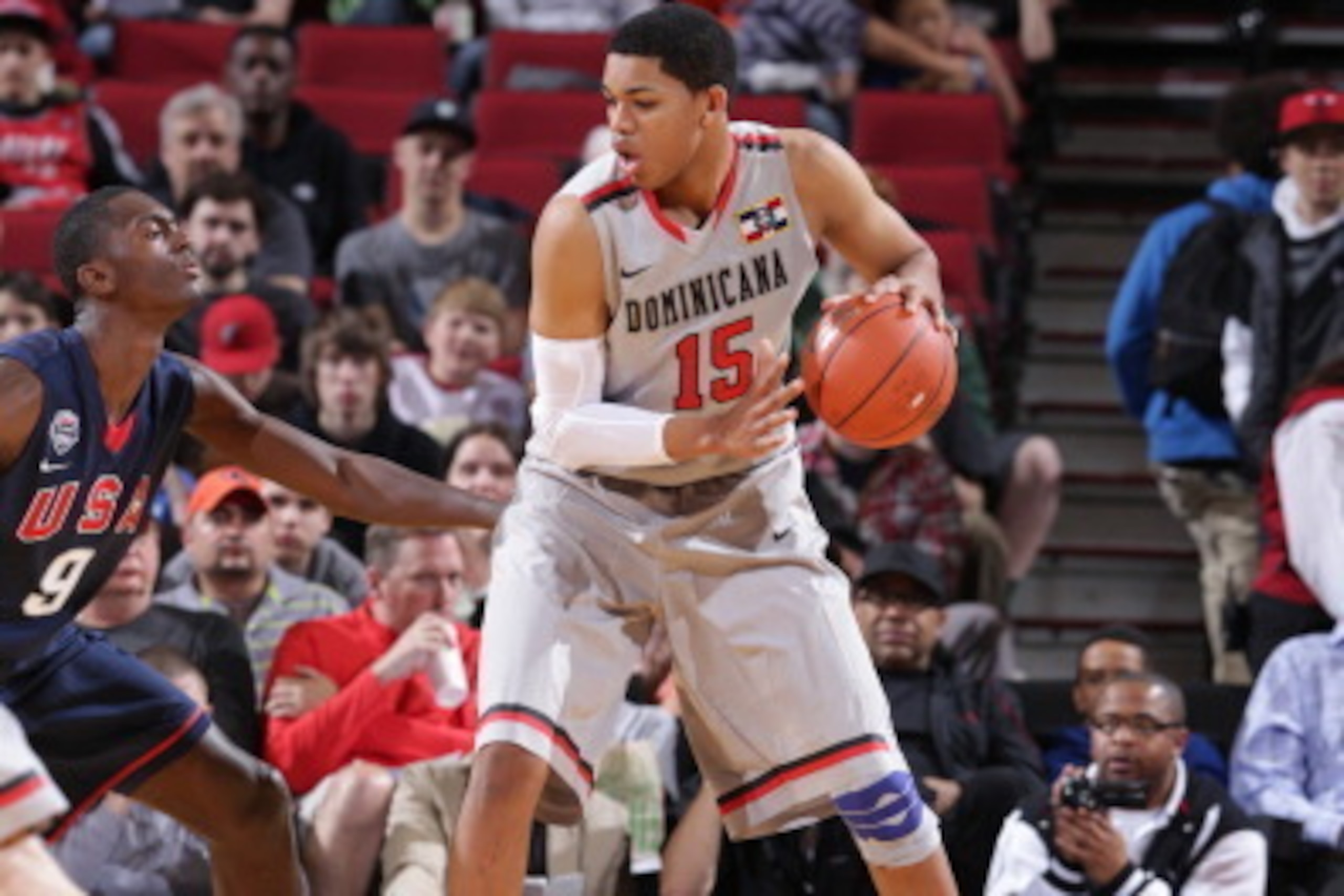 PORTLAND, OR - APRIL 20: Karl Towns #15 of the World Select Team controls the ball against Bobby Portis #9 of the USA Junior Select Team during the 2013 Nike Hoop Summit game on April 20, 2013 at the Rose Garden Arena in Portland, Oregon. NOTE TO USER: Us PORTLAND, OR - APRIL 20: Karl Towns #15 of the World Select Team controls the ball against Bobby Portis #9 of the USA Junior Select Team during the 2013 Nike Hoop Summit game on April 20, 2013 at the Rose Garden Arena in Portland, Oregon. NOTE TO USER: Us