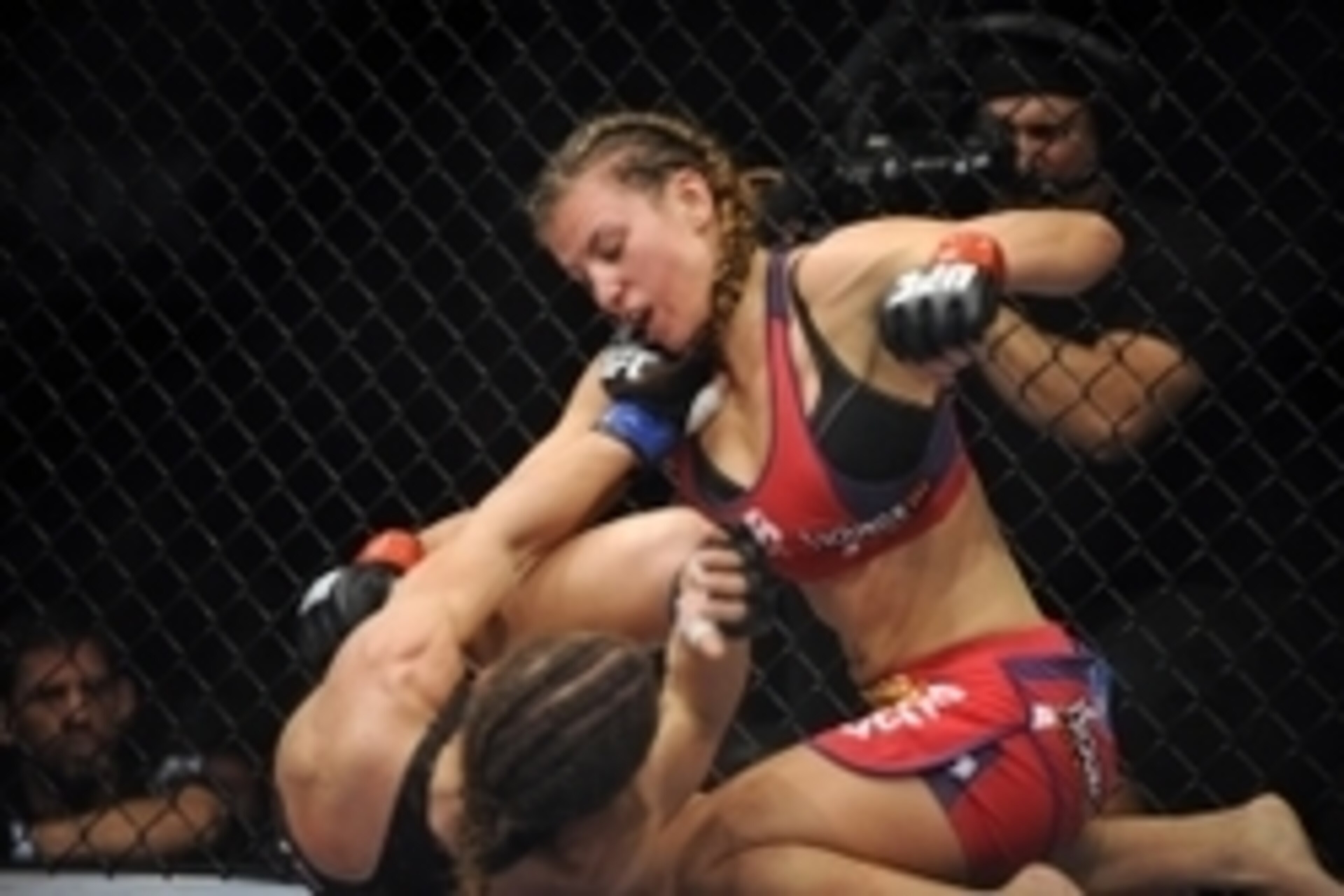 Apr 19, 2014; Orlando, FL, USA; (Editors note: Caption correction) Miesha Tate (red gloves) fights Liz Carmouche (blue gloves) in their women's bantamweight fight during UFC on FOX 11 at Amway Center. Mandatory Credit: David Manning-USA TODAY Sports