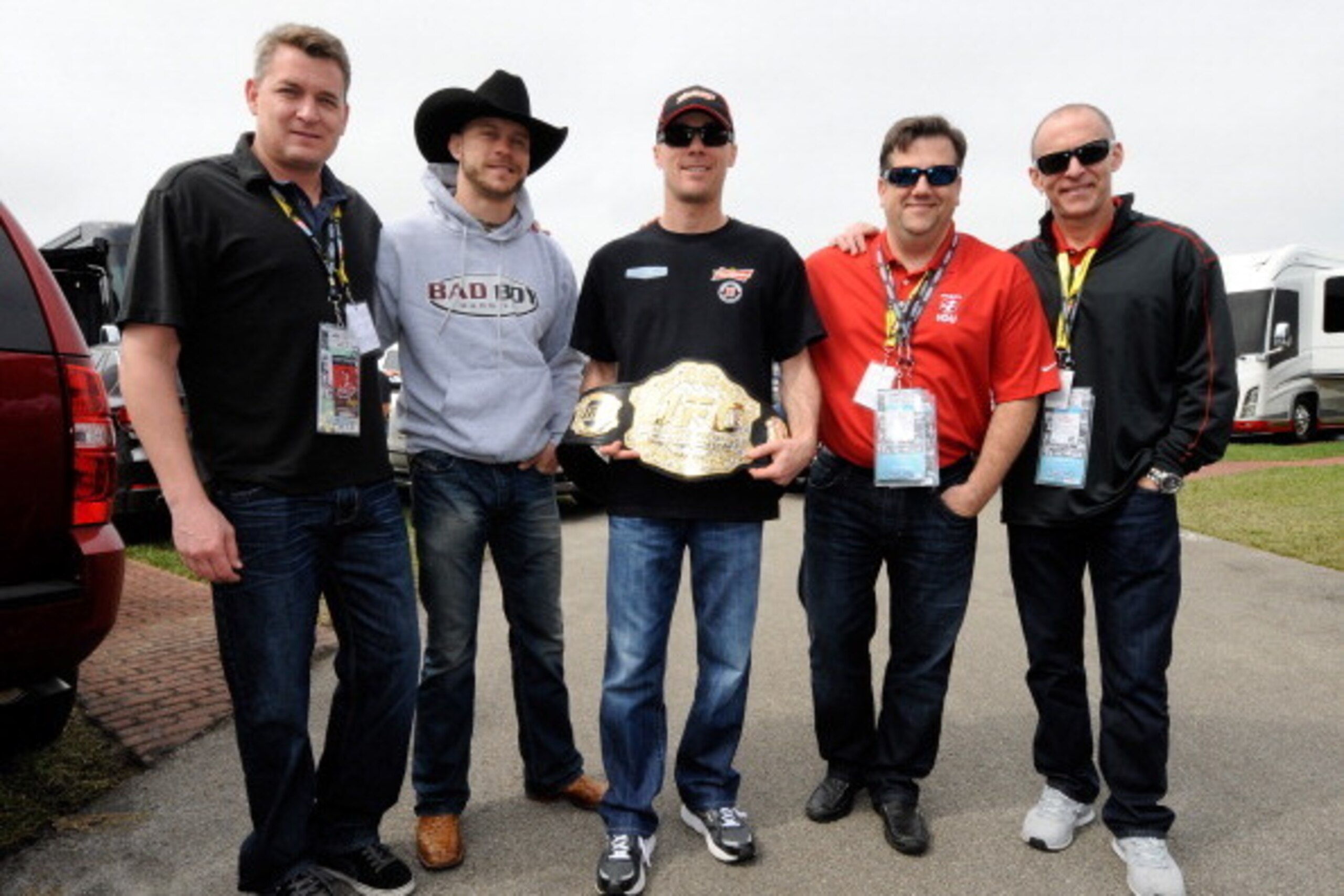 DAYTONA BEACH, FL - FEBRUARY 22:  Donald 'Cowboy' Cerrone (2ndL) presents NASCAR driver Kevin Harvick (C) with an UFC belt at Daytona International Speedway on February 22, 2014 in Daytona Beach, Florida.  (Photo by Jared C. Tilton/Getty Images)