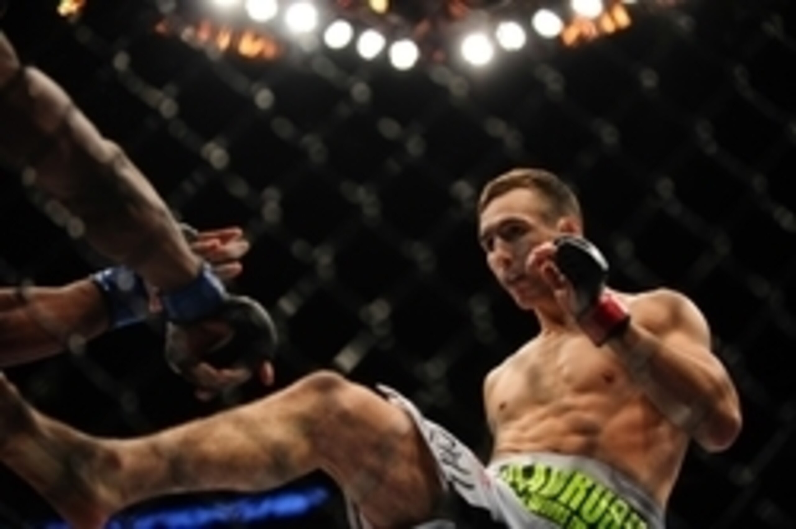 Jun 14, 2014; Vancouver, British Columbia, Canada; Rory MacDonald (red) fights Tyron Woodley (blue) during the Welterweigtht bout at UFC 174 at Rogers Arena. Rory MacDonald defeats Tyron Woodley  via unanimous decision. Mandatory Credit: Anne-Marie Sorvin