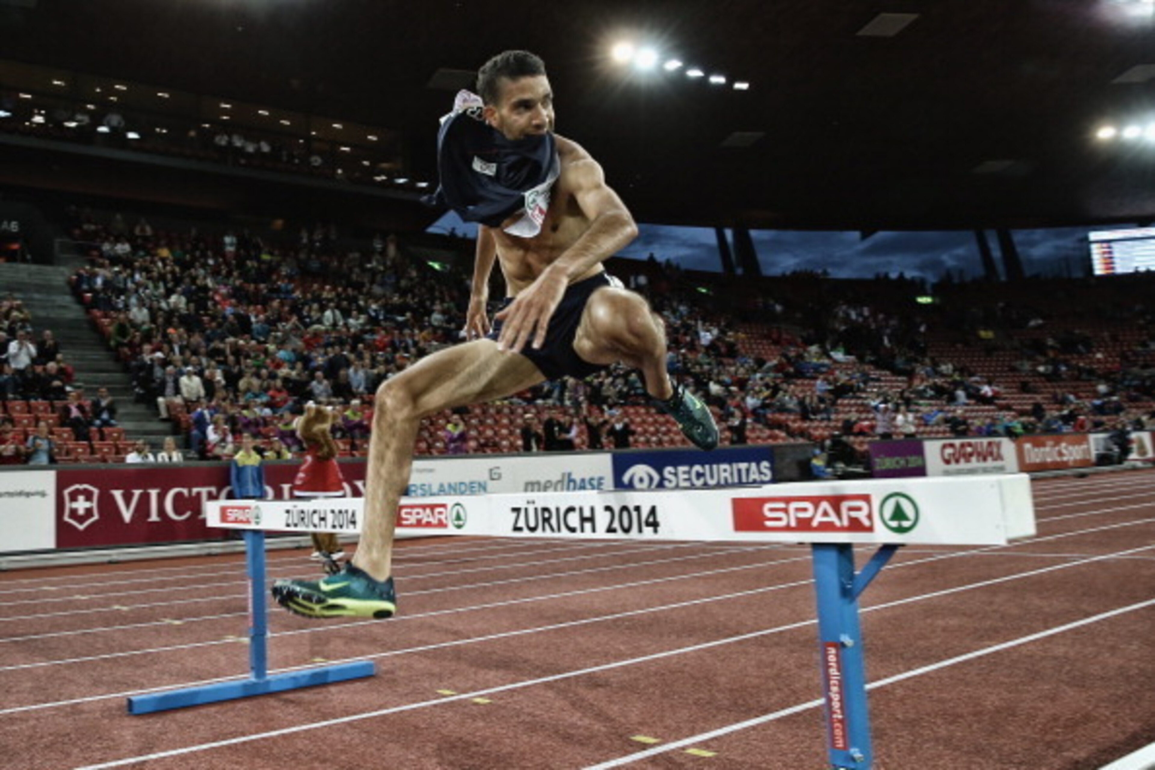ZURICH, SWITZERLAND - AUGUST 14:  (Editors note: A digital filter has been applied to this image) Mahiedine Mekhissi-Benabbad of France jumps the final barrier to win the Mens 3,000m Final at Stadium Letzigrund on August 14, 2014 in Zurich, Switzerland.  