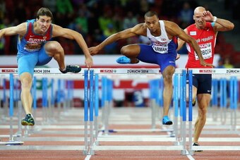 ZURICH, SWITZERLAND - AUGUST 14:  Sergey Shubenkov (L) of Russia beats Will Sharman of Great Britain to first place in the Mens 110m Hurdles Final day three of the European Athletic Championships at Stadium Letzigrund on August 14, 2014 in Zurich, Switzer