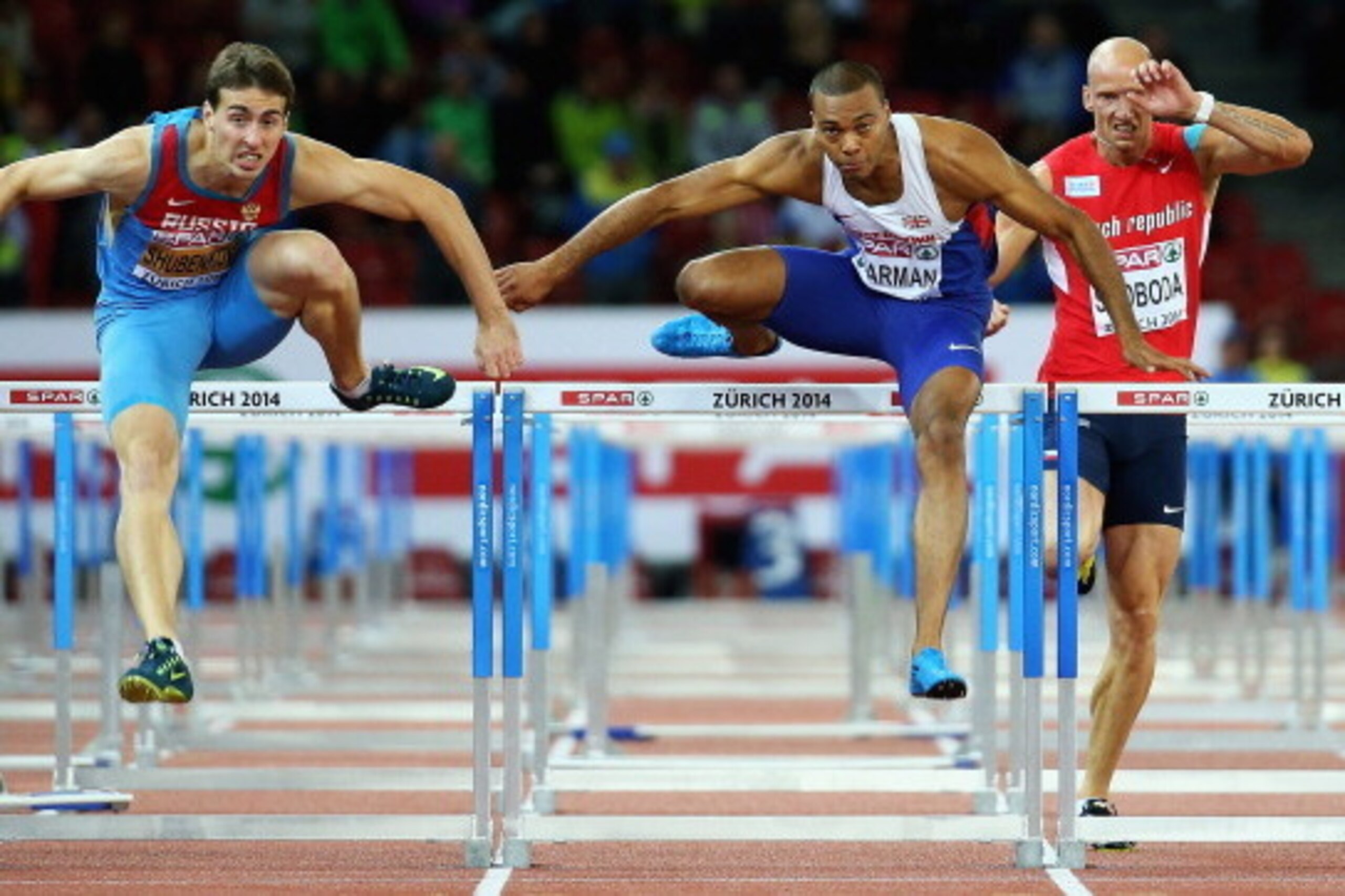 ZURICH, SWITZERLAND - AUGUST 14: Sergey Shubenkov (L) of Russia beats Will Sharman of Great Britain to first place in the Mens 110m Hurdles Final day three of the European Athletic Championships at Stadium Letzigrund on August 14, 2014 in Zurich, Switzer ZURICH, SWITZERLAND - AUGUST 14: Sergey Shubenkov (L) of Russia beats Will Sharman of Great Britain to first place in the Mens 110m Hurdles Final day three of the European Athletic Championships at Stadium Letzigrund on August 14, 2014 in Zurich, Switzer
