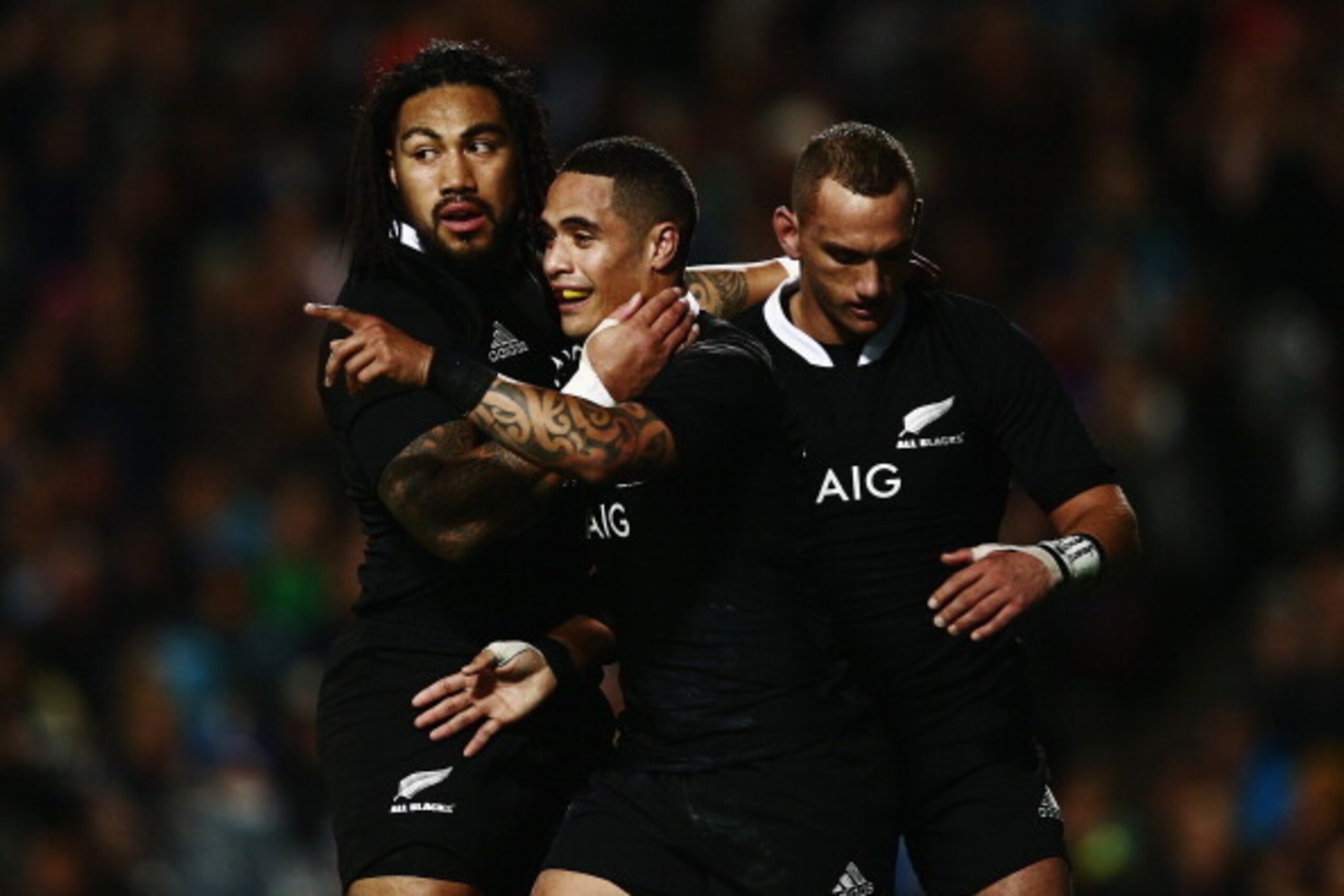 HAMILTON, NEW ZEALAND - JUNE 21:  Aaron Smith of the All Blacks celebrates with Ma'a Nonu and Aaron Cruden after scoring his second try during the International Test match between the New Zealand All Blacks and England at Waikato Stadium on June 21, 2014 