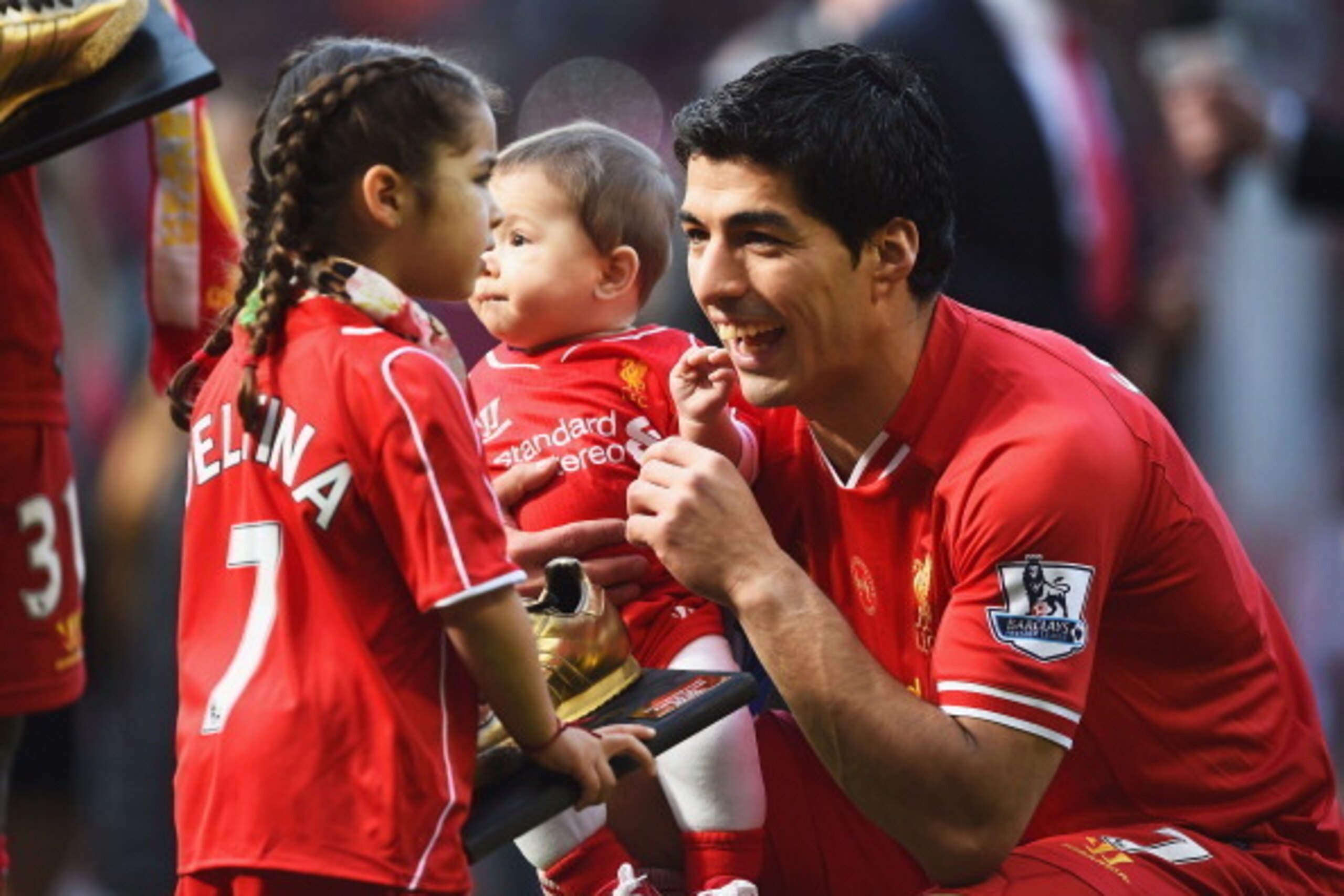 LIVERPOOL, ENGLAND - MAY 11:  Luis Suarez of Liverpool with his children Delfina and Benjamin after the Barclays Premier League match between Liverpool and Newcastle United at Anfield on May 11, 2014 in Liverpool, England. Liverpool finish as runners-up i