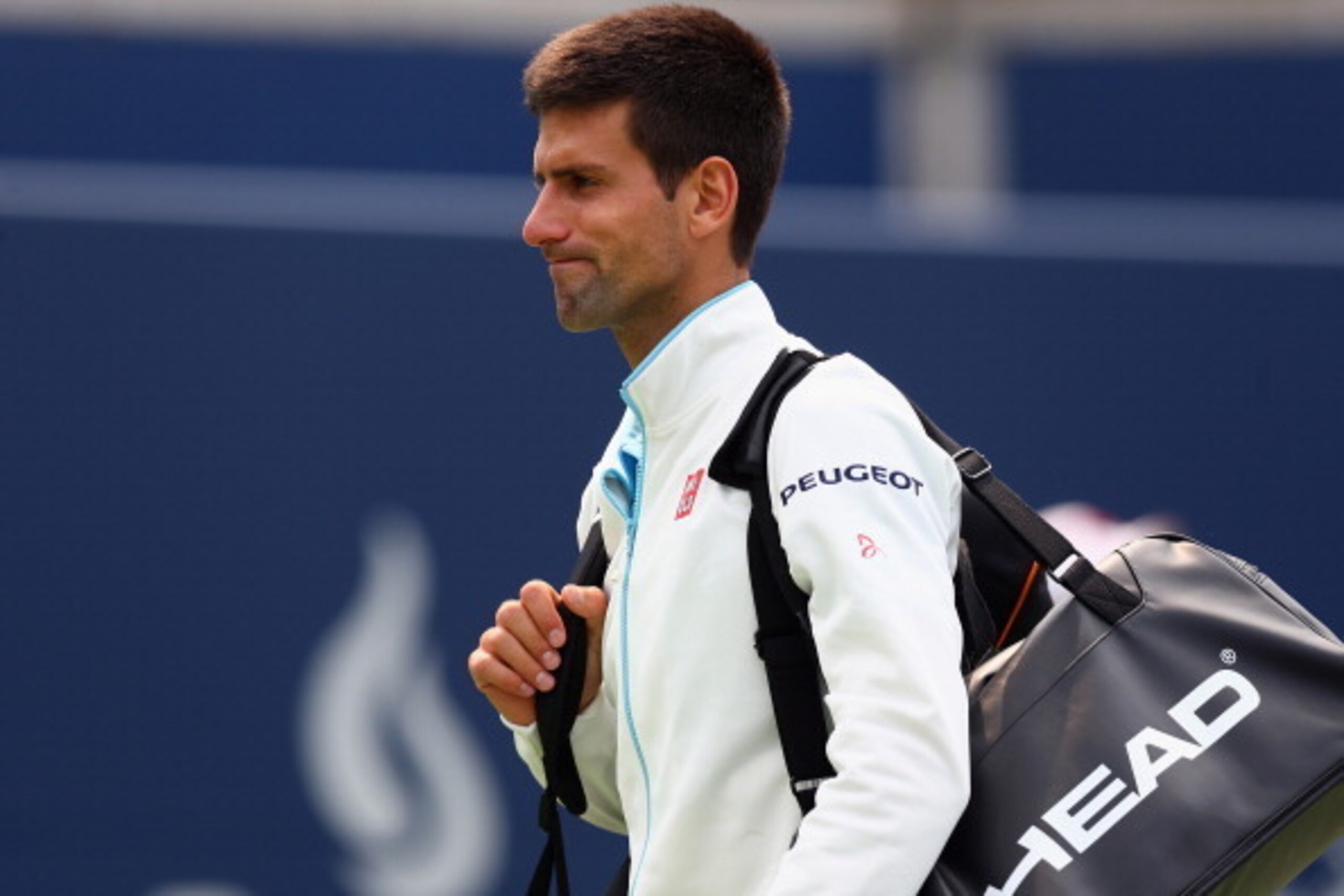 TORONTO, ON - AUGUST 07:  Novak Djokovic of Serbia walks off the court after a loss against Jo-Wilfried Tsonga of France during Rogers Cup at Rexall Centre at York University on August 7, 2014 in Toronto, Canada.  (Photo by Ronald Martinez/Getty Images)