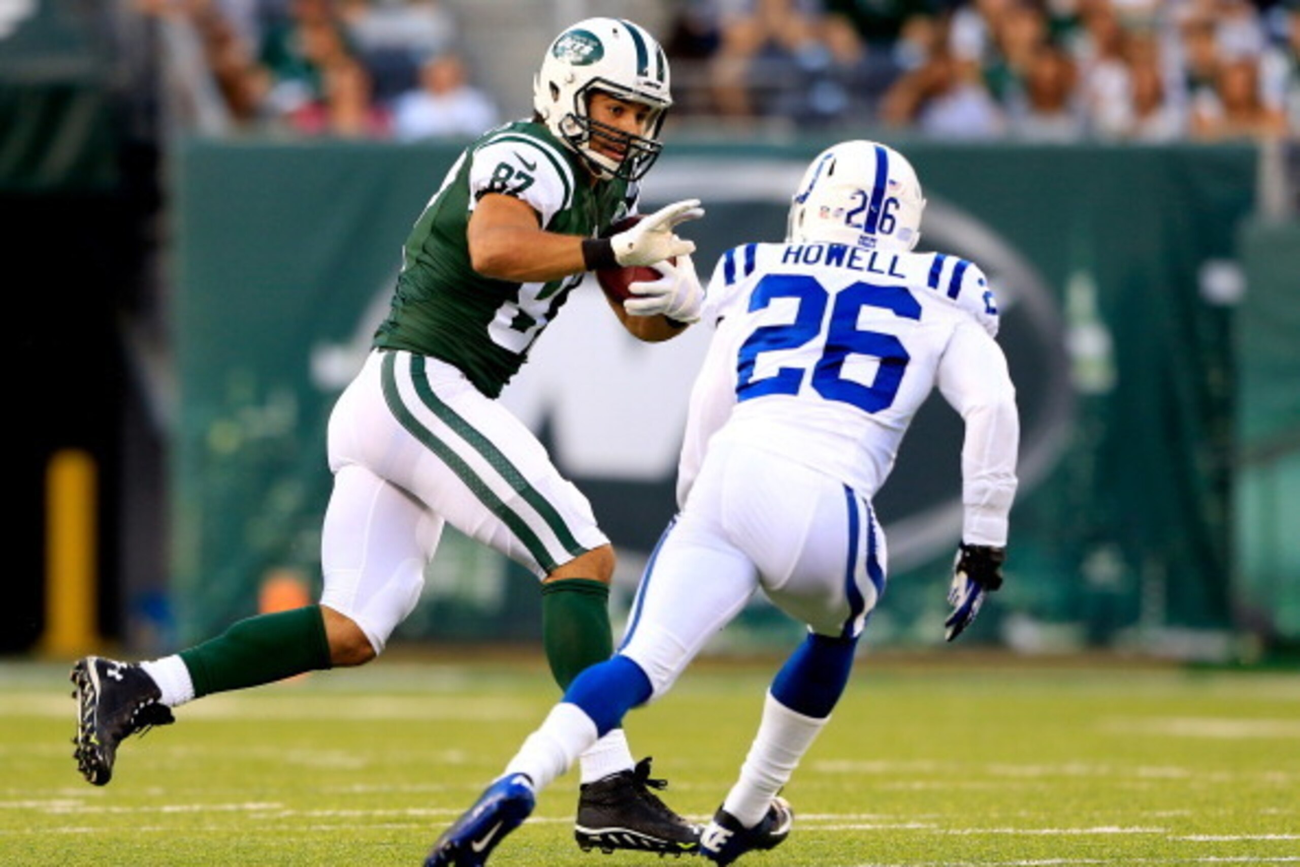EAST RUTHERFORD, NJ - AUGUST 07: Wide receiver Eric Decker #87 of the New York Jets runs with the ball after making a catch in the first quarter as free safety Delano Howell #26 of the Indianapolis Colts defends during a preseason game at MetLife Stadium EAST RUTHERFORD, NJ - AUGUST 07: Wide receiver Eric Decker #87 of the New York Jets runs with the ball after making a catch in the first quarter as free safety Delano Howell #26 of the Indianapolis Colts defends during a preseason game at MetLife Stadium