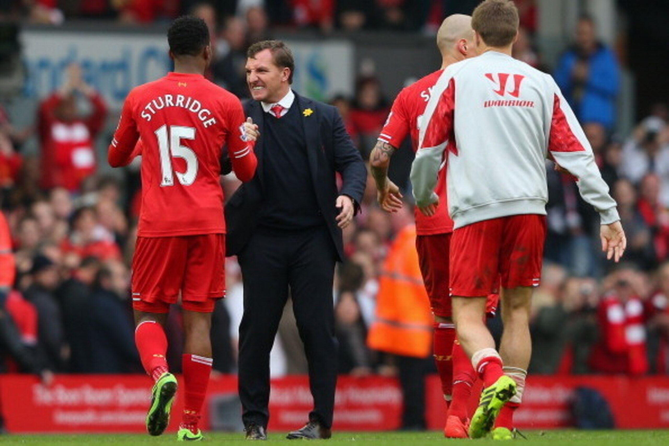 LIVERPOOL, ENGLAND - MARCH 30:  Liverpool Manager Brendan Rodgers congratulates Daniel Sturridge of Liverpool at the end of the Barclays Premier League match between Liverpool and Tottenham Hotspur at Anfield on March 30, 2014 in Liverpool, England.  (Pho