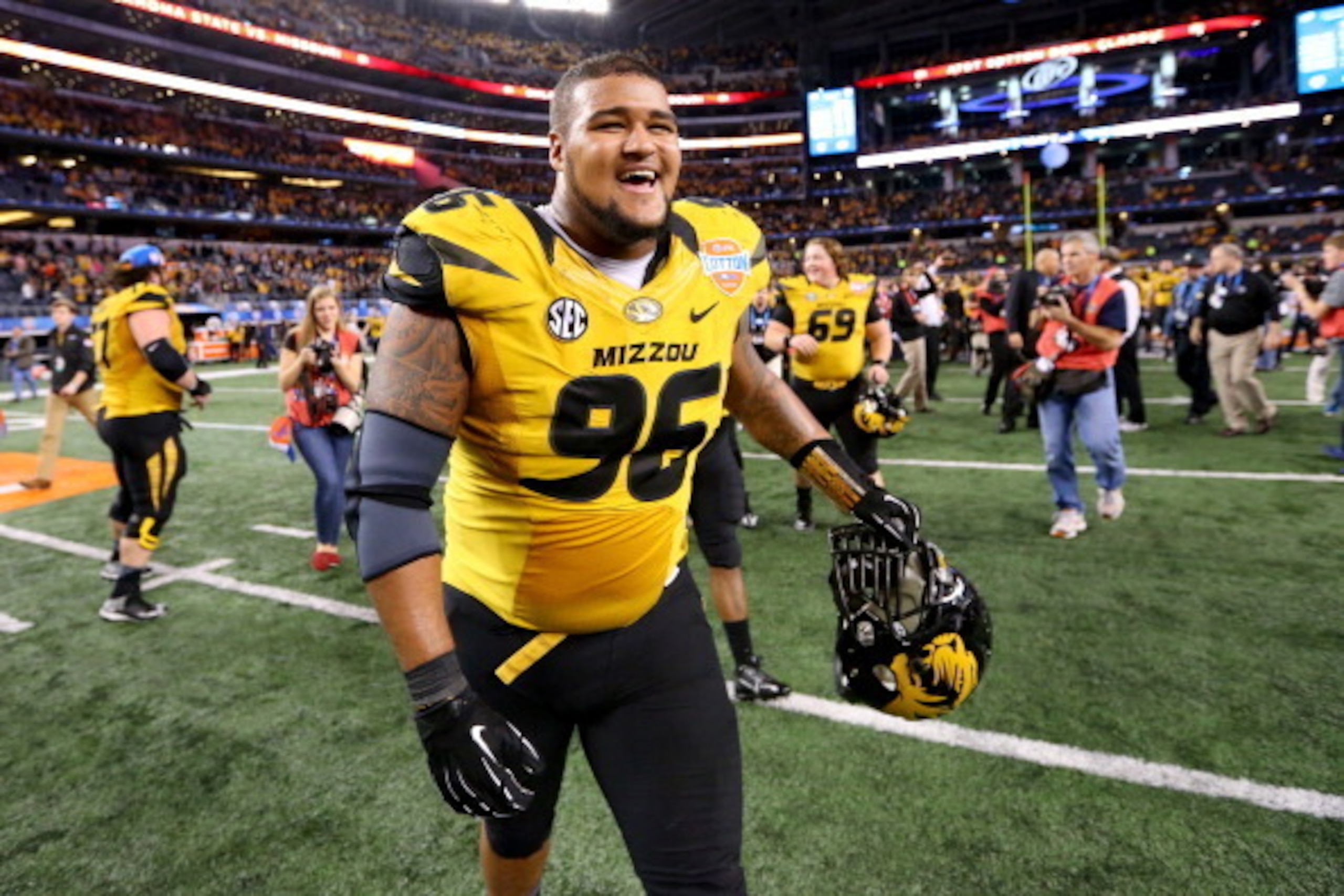ARLINGTON, TX - JANUARY 03: Lucas Vincent #96 of the Missouri Tigers celebrates the Tigers 41-31 victory against the Oklahoma State Cowboys during the AT&T Cotton Bowl on January 3, 2014 in Arlington, Texas. (Photo by Ronald Martinez/Getty Images) ARLINGTON, TX - JANUARY 03: Lucas Vincent #96 of the Missouri Tigers celebrates the Tigers 41-31 victory against the Oklahoma State Cowboys during the AT&T Cotton Bowl on January 3, 2014 in Arlington, Texas. (Photo by Ronald Martinez/Getty Images)