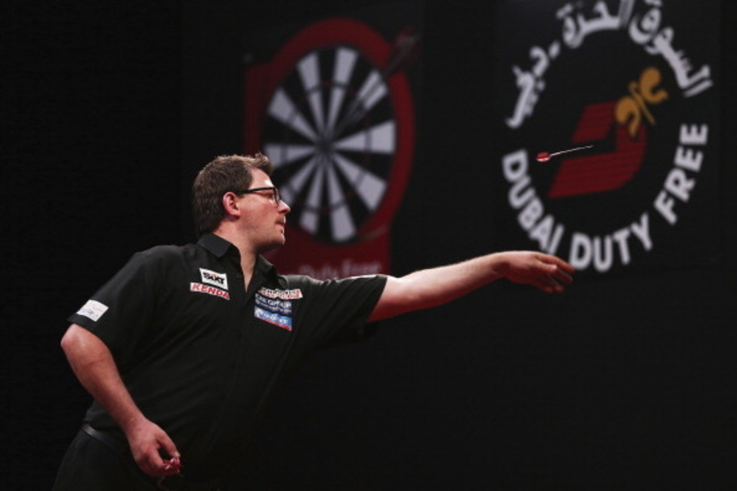 DUBAI, UNITED ARAB EMIRATES - MAY 29:  James Wade of England plays against Michael Van Gerwen of the Netherland during the 2014 Dubai Duty Free Darts Masters Quarter-Final match at Dubai Duty Free Tennis Stadium, Irish Village on May 29, 2014 in Dubai, Un