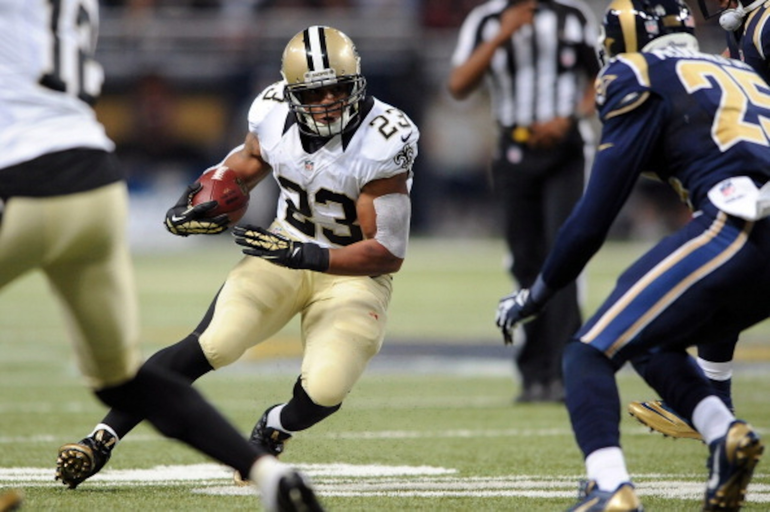 ST. LOUIS, MO - DECEMBER 15: Pierre Thomas #23 of the New Orleans Saints rushes against the St. Louis Rams in the second quarter at the Edward Jones Dome on December 15, 2013 in St. Louis, Missouri.  (Photo by Michael Thomas/Getty Images)