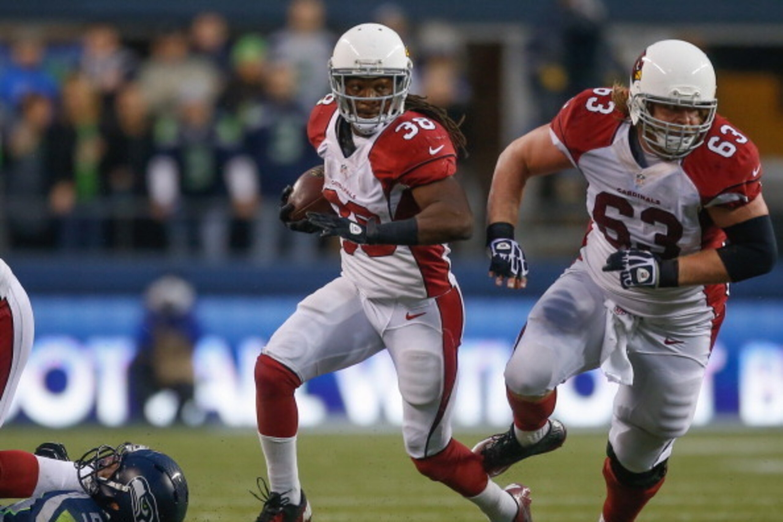 SEATTLE, WA - DECEMBER 22:  Running back Andre Ellington #38 of the Arizona Cardinals rushes against the Seattle Seahawks at CenturyLink Field on December 22, 2013 in Seattle, Washington.  (Photo by Otto Greule Jr/Getty Images)
