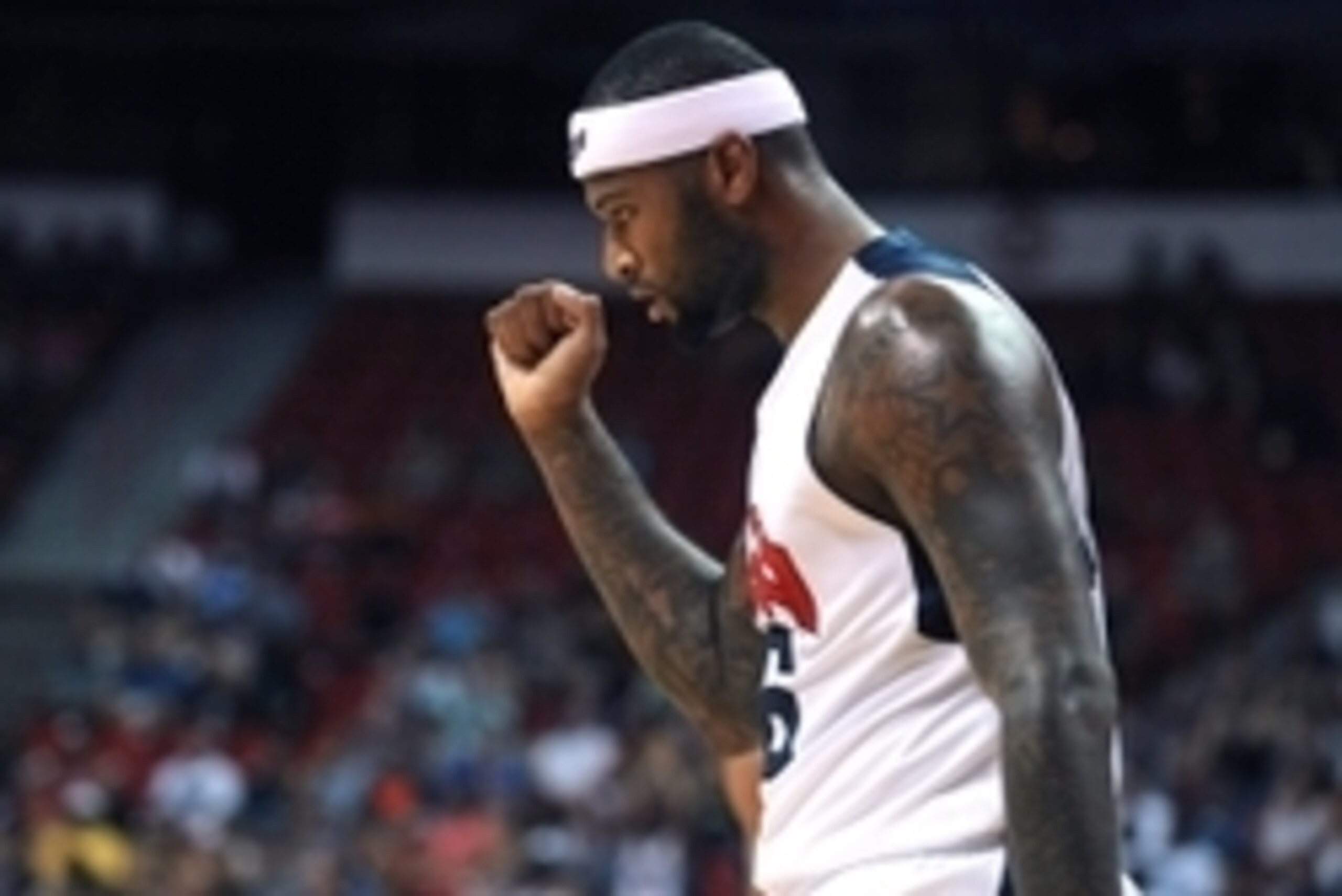 Aug 1, 2014; Las Vegas, NV, USA; USA Team White center DeMarcus Cousins (36) celebrates after assisting on a score during the USA Basketball Showcase at Thomas & Mack Center. Mandatory Credit: Stephen R. Sylvanie-USA TODAY Sports