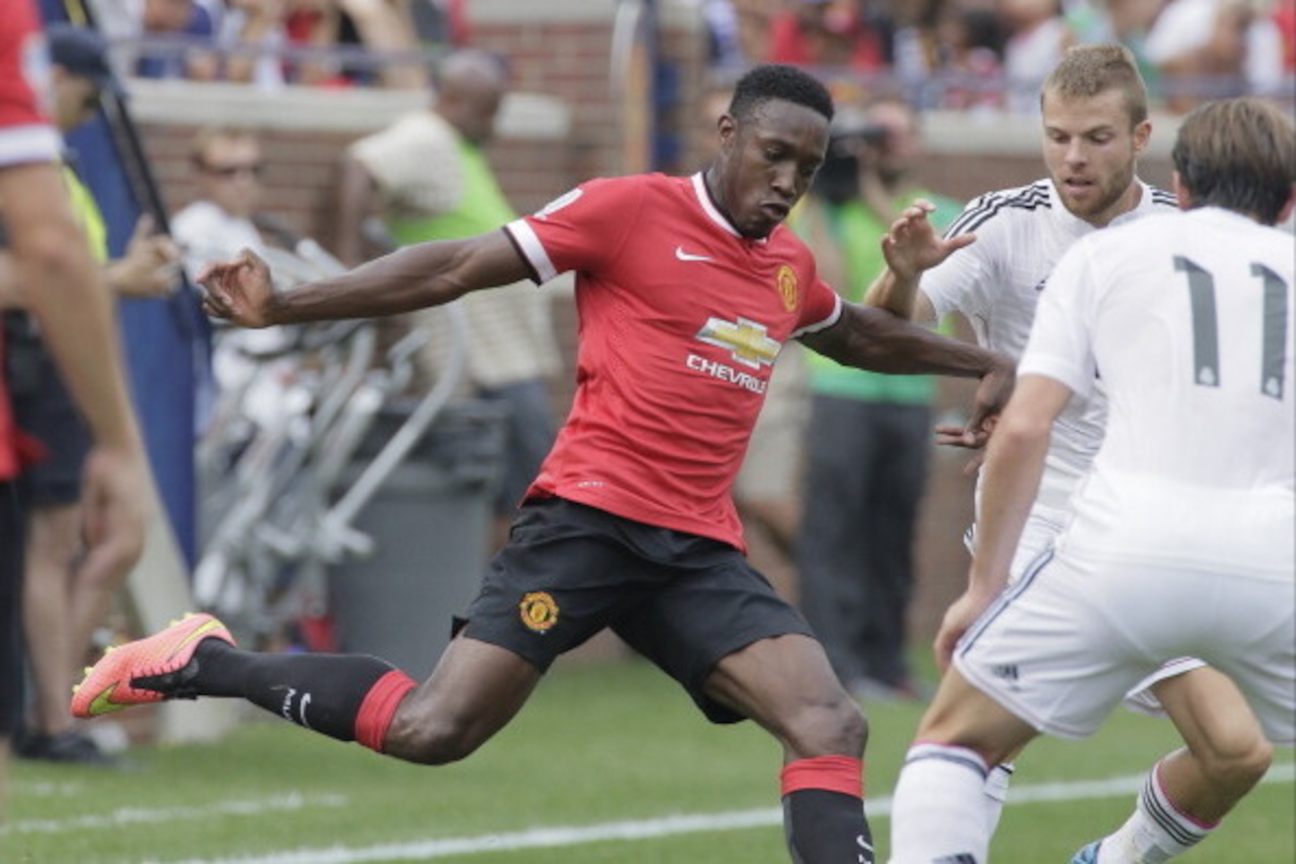 ANN ARBOR, MI - AUGUST 2: Danny Welbeck #19 of Manchester United kicks the ball against Gareth Bale #11 and Asier Illarramendi #24 of Real Madrid during the first half of the Guinness International Champions Cup at Michigan Stadium on August 2, 2014, in A
