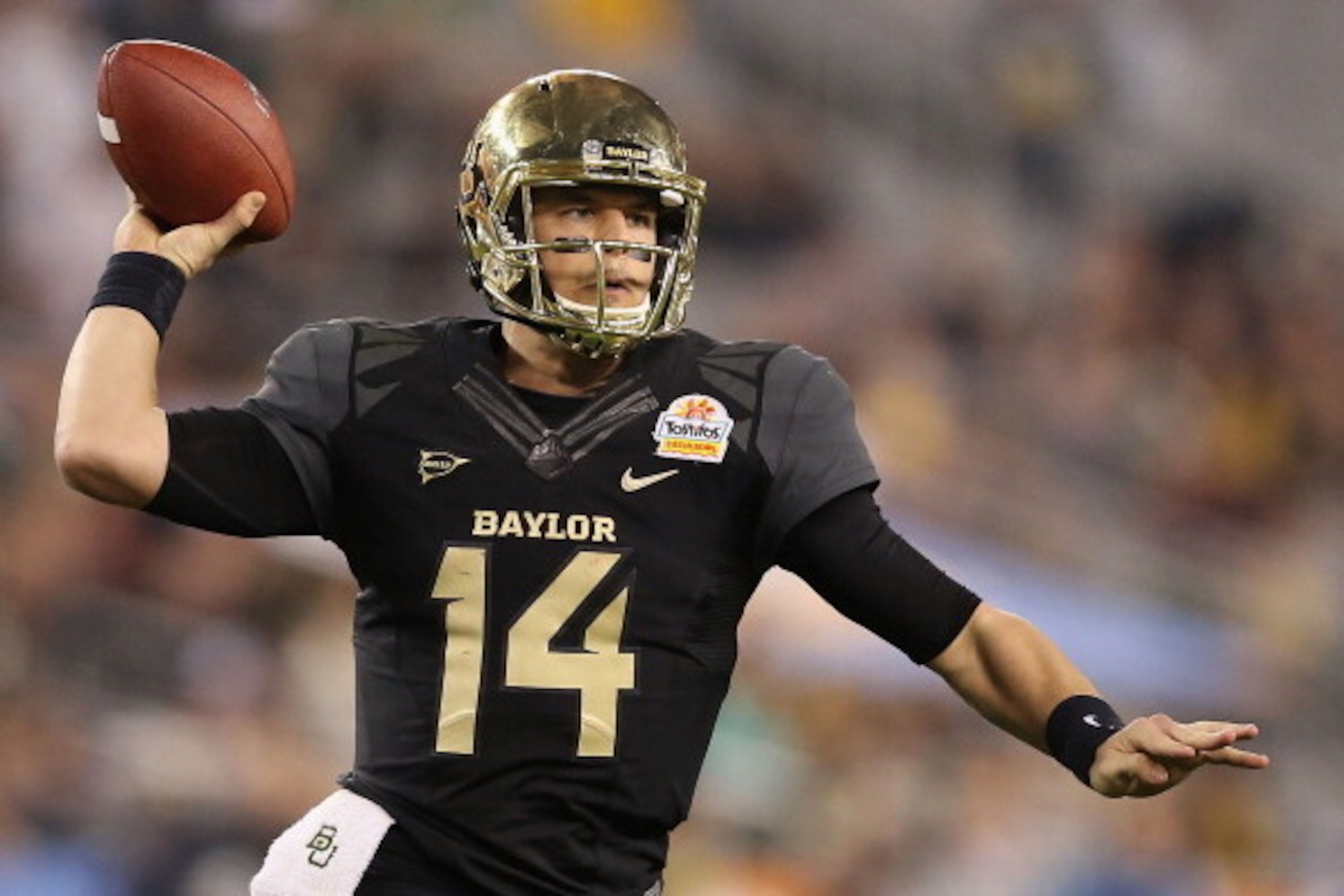 GLENDALE, AZ - JANUARY 01: Quarterback Bryce Petty #14 of the Baylor Bears scrambles to pass during the Tostitos Fiesta Bowl against the UCF Knights at University of Phoenix Stadium on January 1, 2014 in Glendale, Arizona. (Photo by Christian Petersen/G GLENDALE, AZ - JANUARY 01: Quarterback Bryce Petty #14 of the Baylor Bears scrambles to pass during the Tostitos Fiesta Bowl against the UCF Knights at University of Phoenix Stadium on January 1, 2014 in Glendale, Arizona. (Photo by Christian Petersen/G