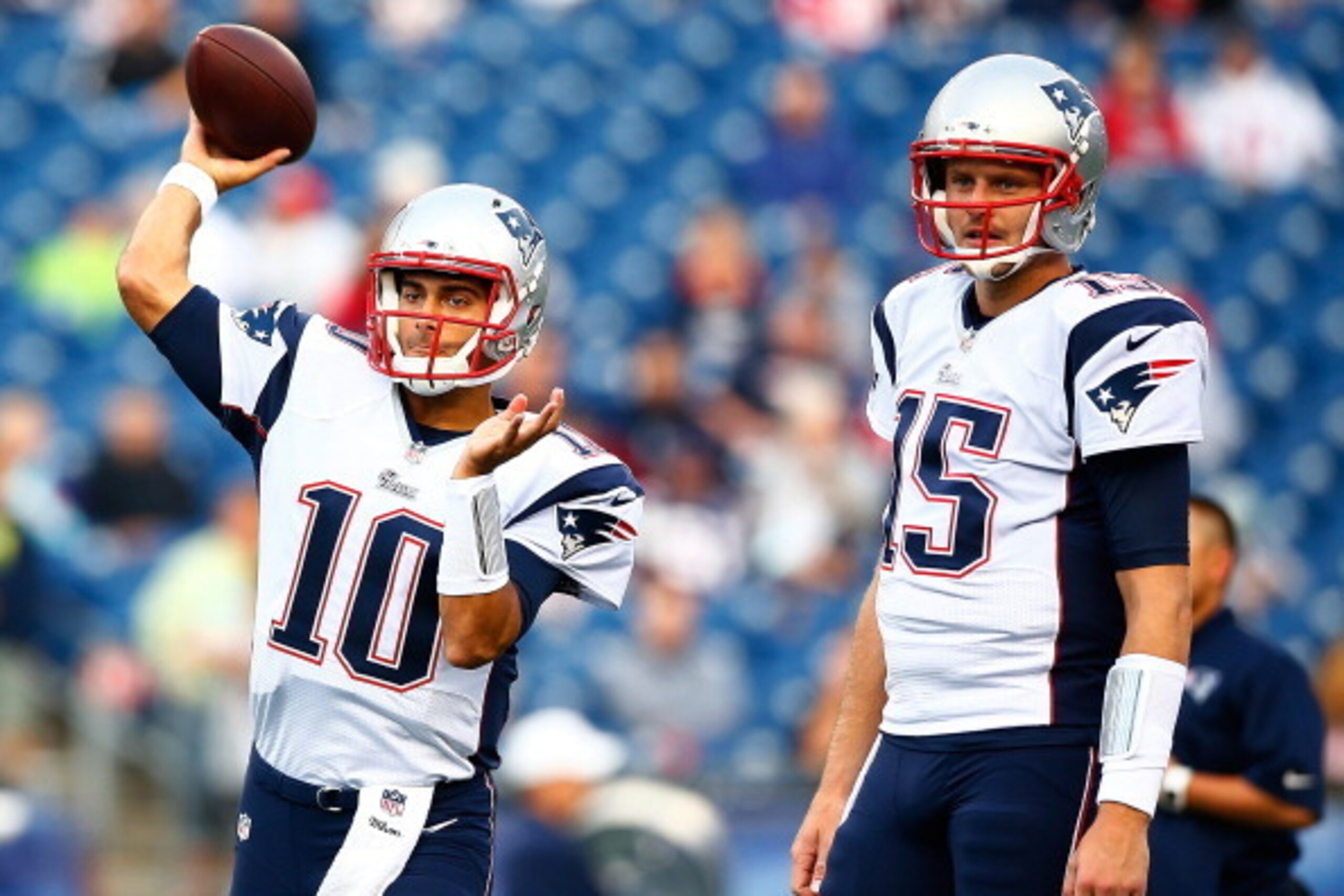 FOXBORO, MA - AUGUST 15: Jimmy Garoppolo #10 and Ryan Mallett #15 of the New England Patriots warm up prior to the preseason game against the Philadelphia Eagles at Gillette Stadium on August 15, 2014 in Foxboro, Massachusetts.  (Photo by Jared Wickerham/