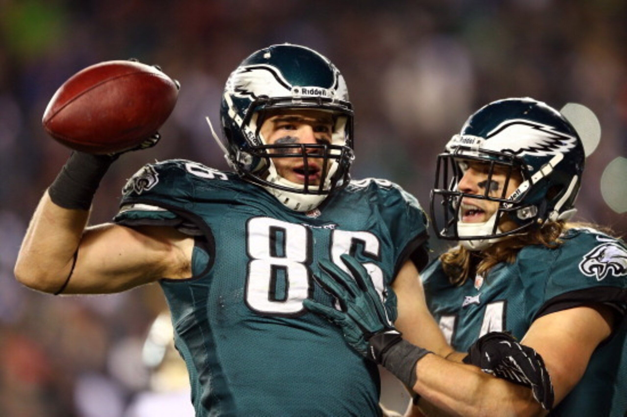 PHILADELPHIA, PA - JANUARY 04:  Zach Ertz #86 of the Philadelphia Eagles celebrates with teammate Riley Cooper #14 after scoring a 3 yard touchdown pass from Nick Foles #9 in the fourth quarter against the New Orleans Saints to take the lead 24-23 during 