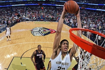 NEW ORLEANS, LA - MARCH 22:  Anthony Davis #23 of the New Orleans Pelicans dunks against the Miami Heat on March 22, 2014 at the Smoothie King Center in New Orleans, Louisiana. NOTE TO USER: User expressly acknowledges and agrees that, by downloading and 