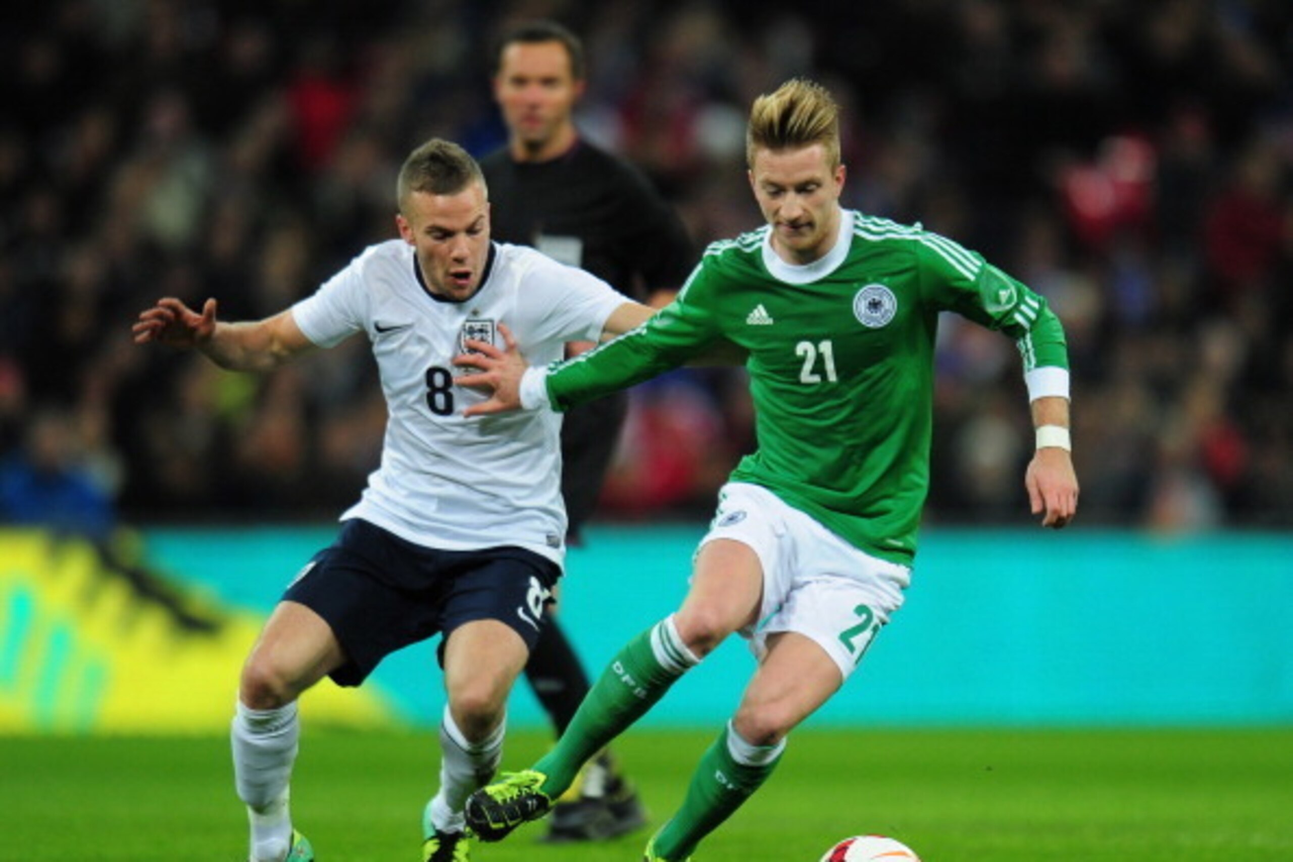 LONDON, ENGLAND - NOVEMBER 19:  Marco Reus of Germany holds off Tom Cleverley of England during the international friendly match between England and Germany at Wembley Stadium on November 19, 2013 in London, England.  (Photo by Shaun Botterill/Getty Image