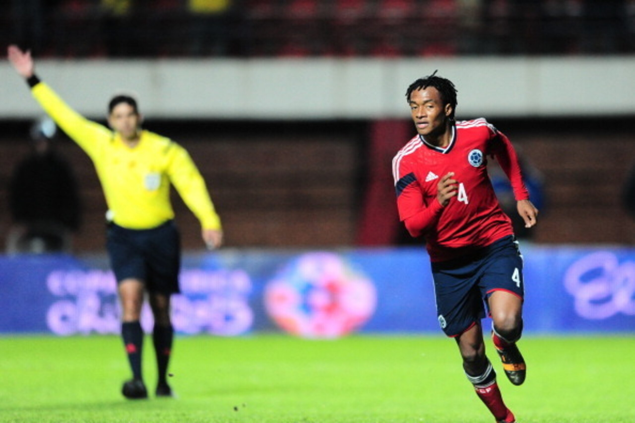 BUENOS AIRES, ARGENTINA - JUNE 06: Juan Cuadrado of Colombia celebrates after shooting a penalty kick to score the second goal during the International Friendly Match between Colombia and Jordan at Pedro Bidegain Stadium on June 06, 2014 in Buenos Aires, BUENOS AIRES, ARGENTINA - JUNE 06: Juan Cuadrado of Colombia celebrates after shooting a penalty kick to score the second goal during the International Friendly Match between Colombia and Jordan at Pedro Bidegain Stadium on June 06, 2014 in Buenos Aires,