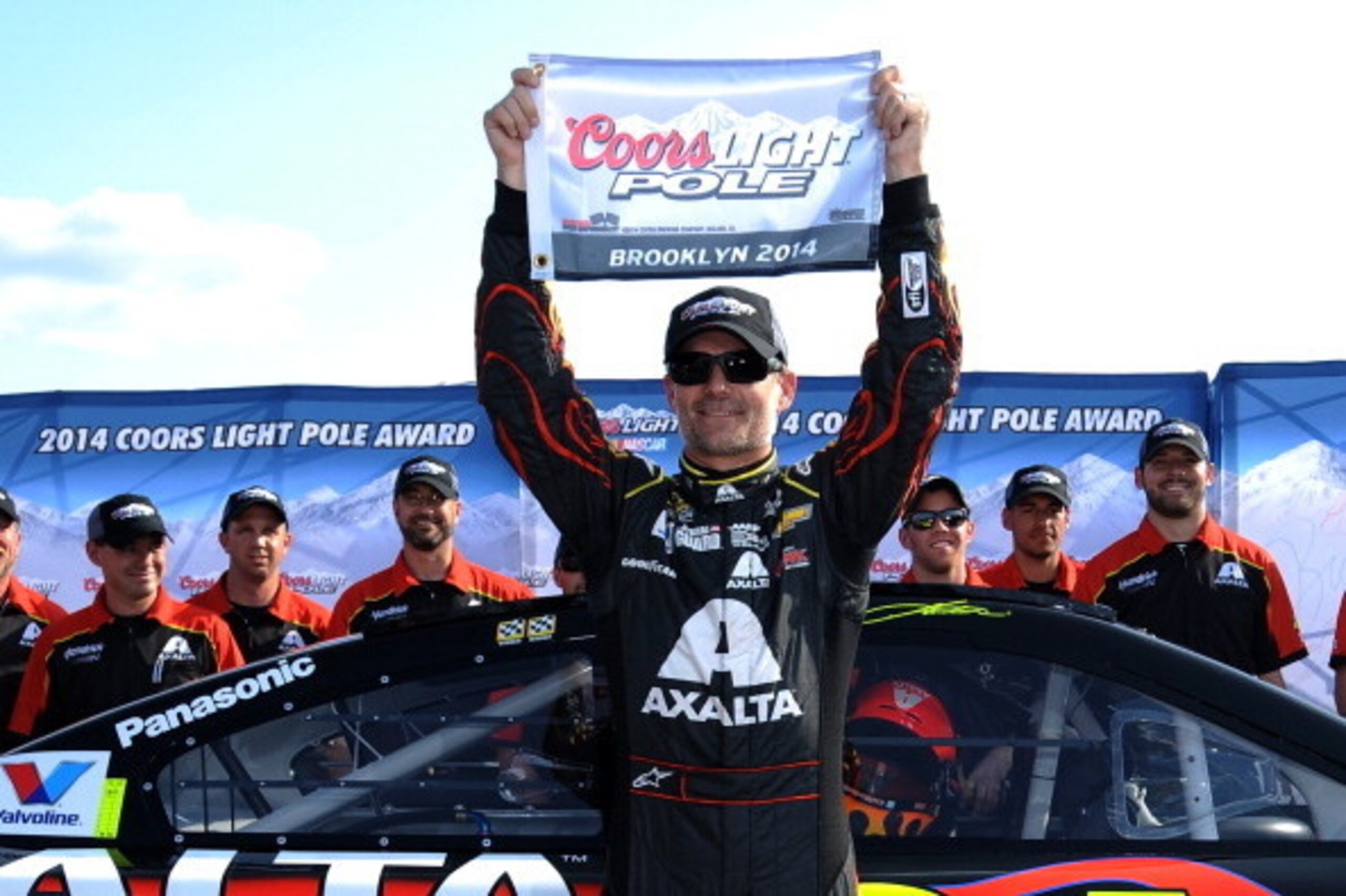 BROOKLYN, MI - AUGUST 15:  Jeff Gordon, driver of the #24 Axalta Chevrolet, celebrates with the Coors Light Pole Award after qualifying for the NASCAR Sprint Cup Series Pure Michigan 400 at Michigan International Speedway on August 15, 2014 in Brooklyn, M