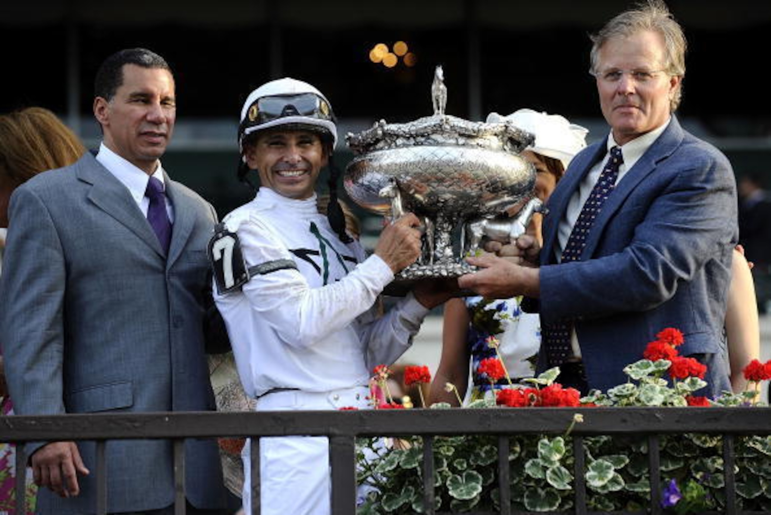 ELMONT, NY - JUNE 05:  Drosselmeyer jockey Mike Smith (L) and trainer Bill Mott are joined by New York State Governor David Paterson as they celebrate winning the 142nd Running of the Belmont Stakes at Belmont Park on June 5, 2010 in Elmont, New York.  (P